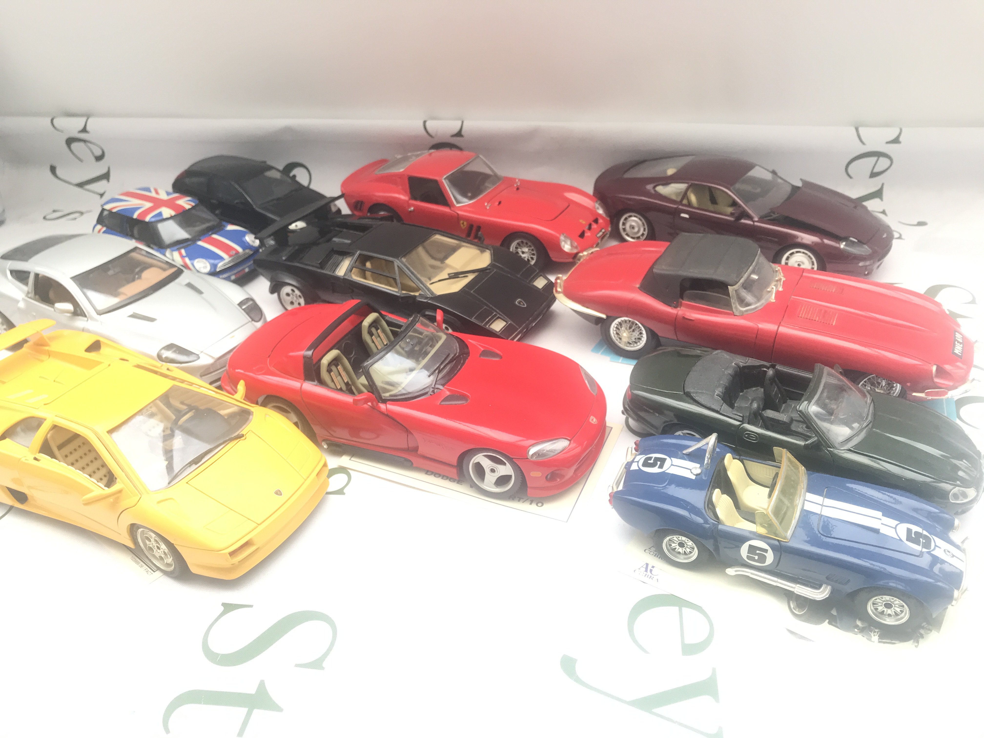 A Collection of Un Boxed Diecast. Varied Scales. Including Maisto. Burago. Franklin Mint Etc. No Reserve.