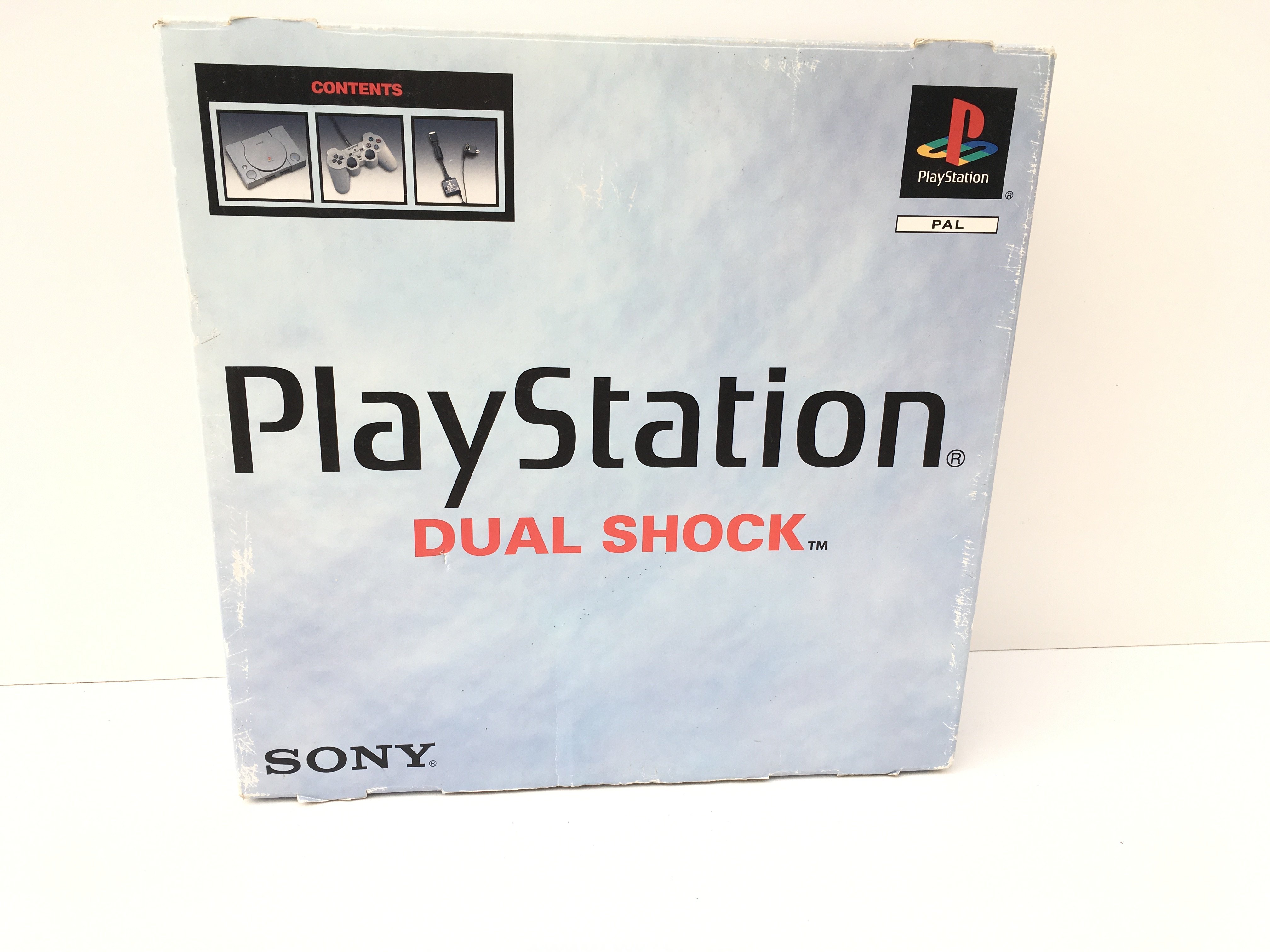 A boxed PlayStation Dual Shock console. Includes controller and cables. No reserve