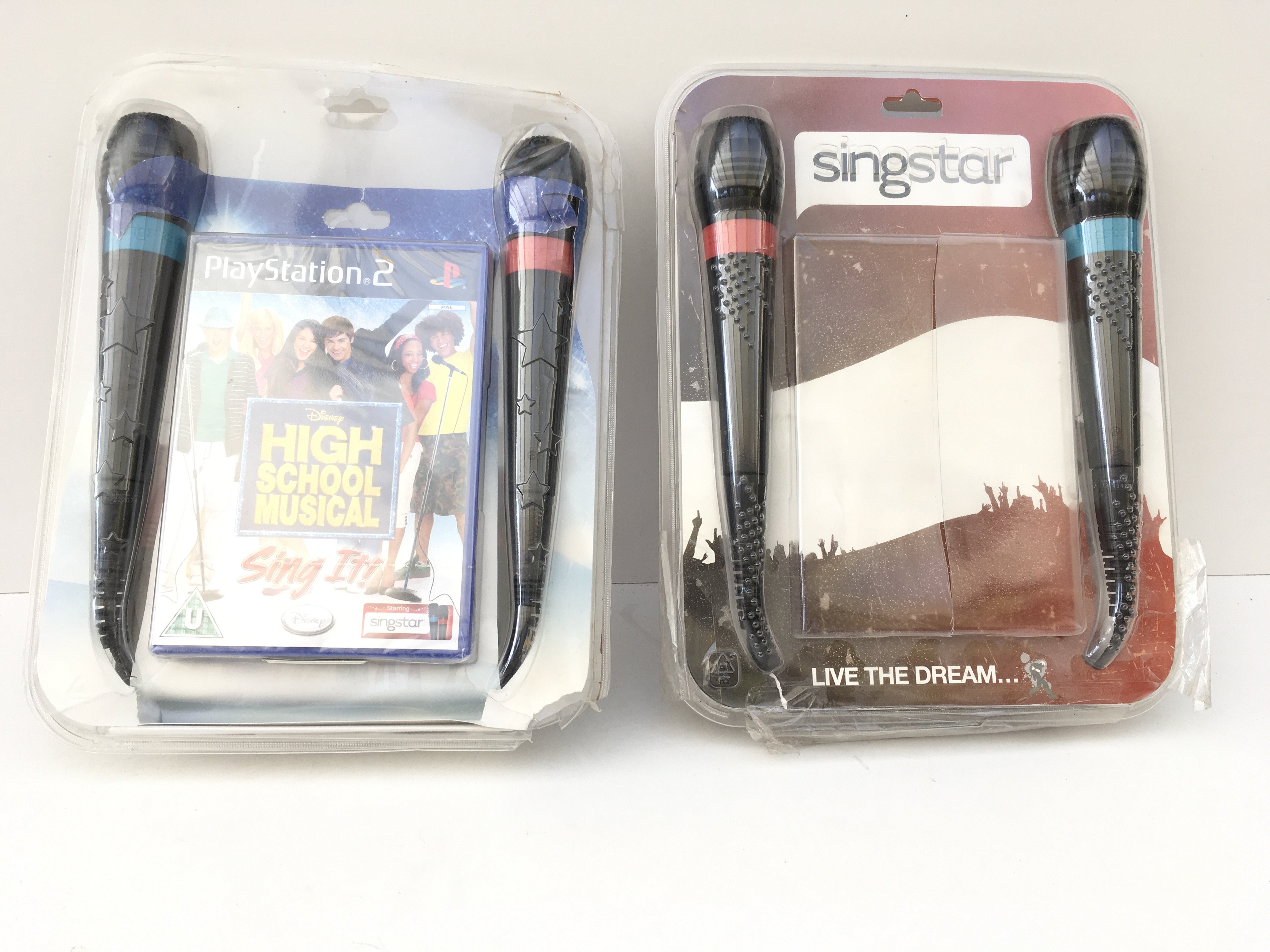 2x Singstar karioke packs 1 with PlayStation 2 disc High School Musical. The 2nd missing disc. 2 microphones in each pack. No reserve