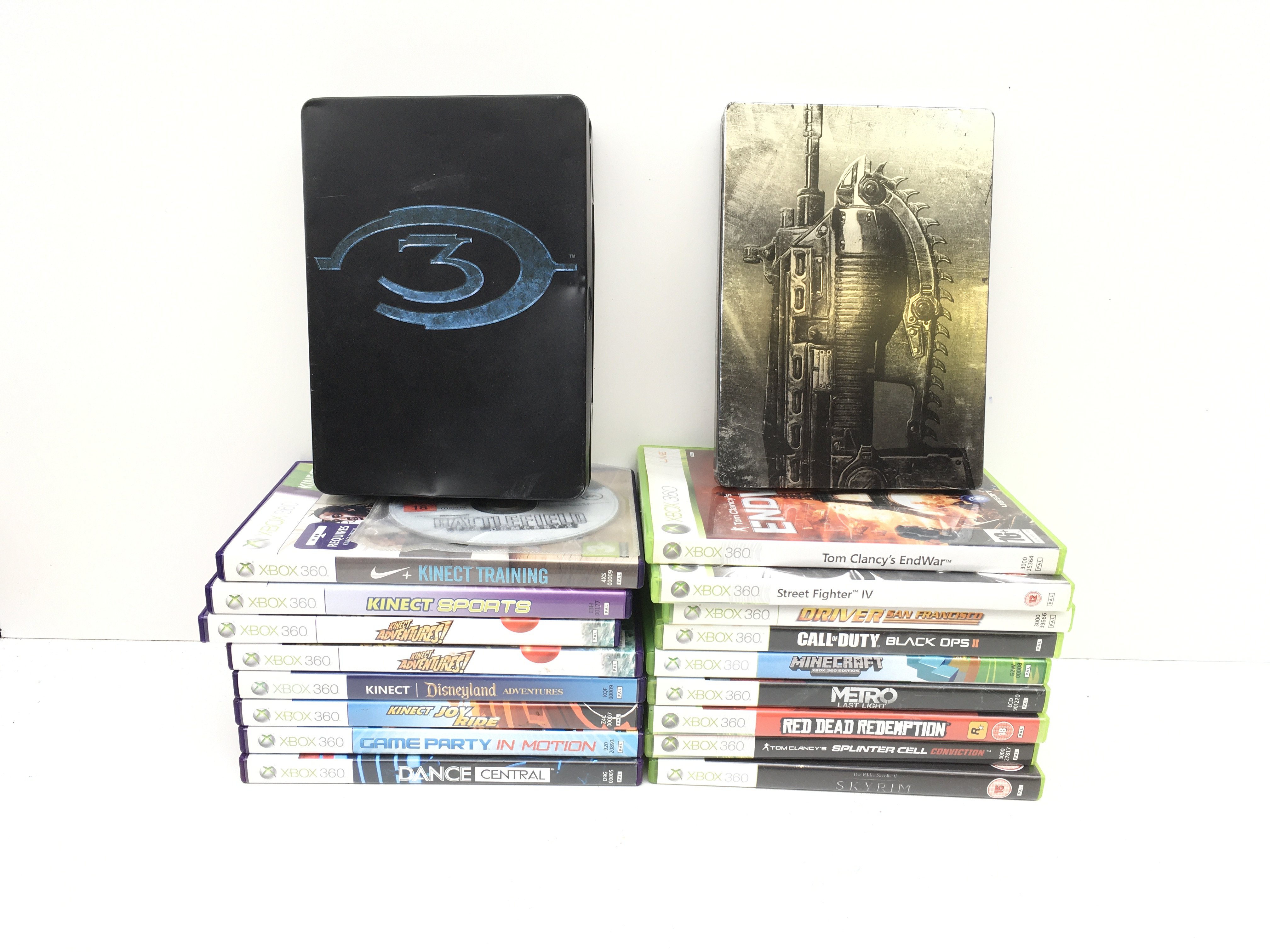 A collection of boxed XBOX 360 discs includes Gears of War and Halo3 in metal cases. No reserve