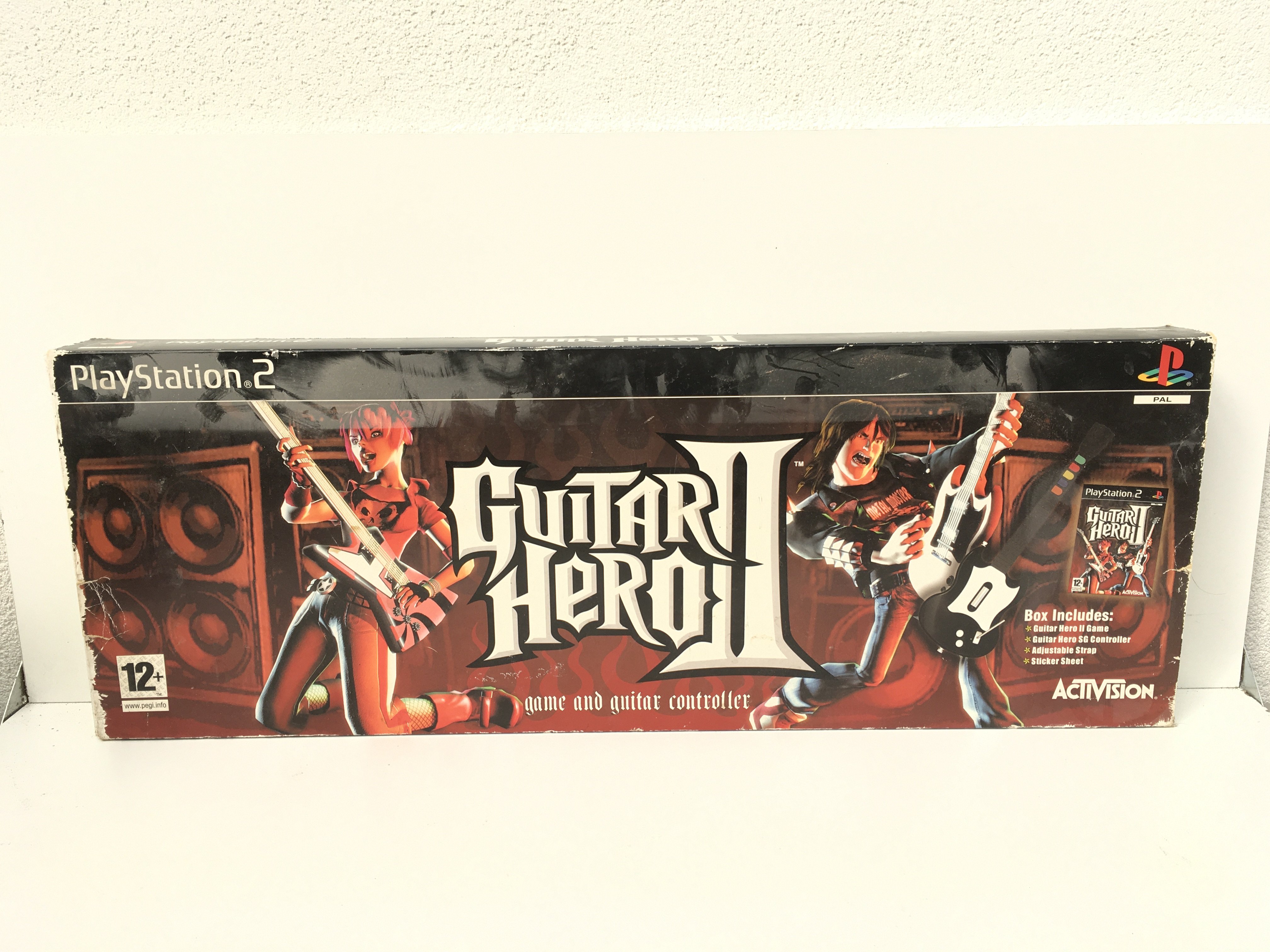 A boxed Guitar Hero II by Activision for PlayStation 2.