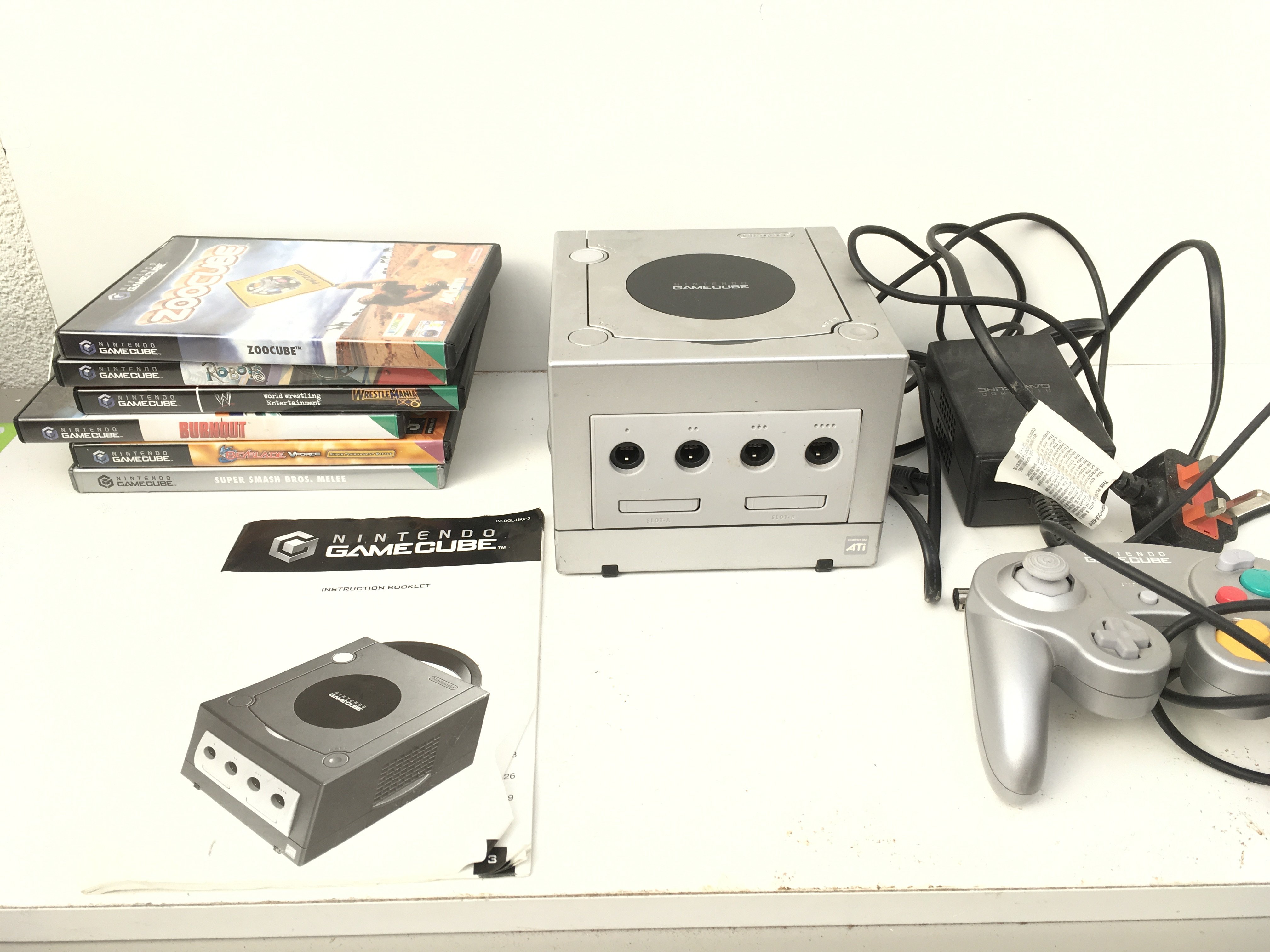 A Nintendo GameCube ..includes controller..power supply..manual and boxed games discs. No reserve.