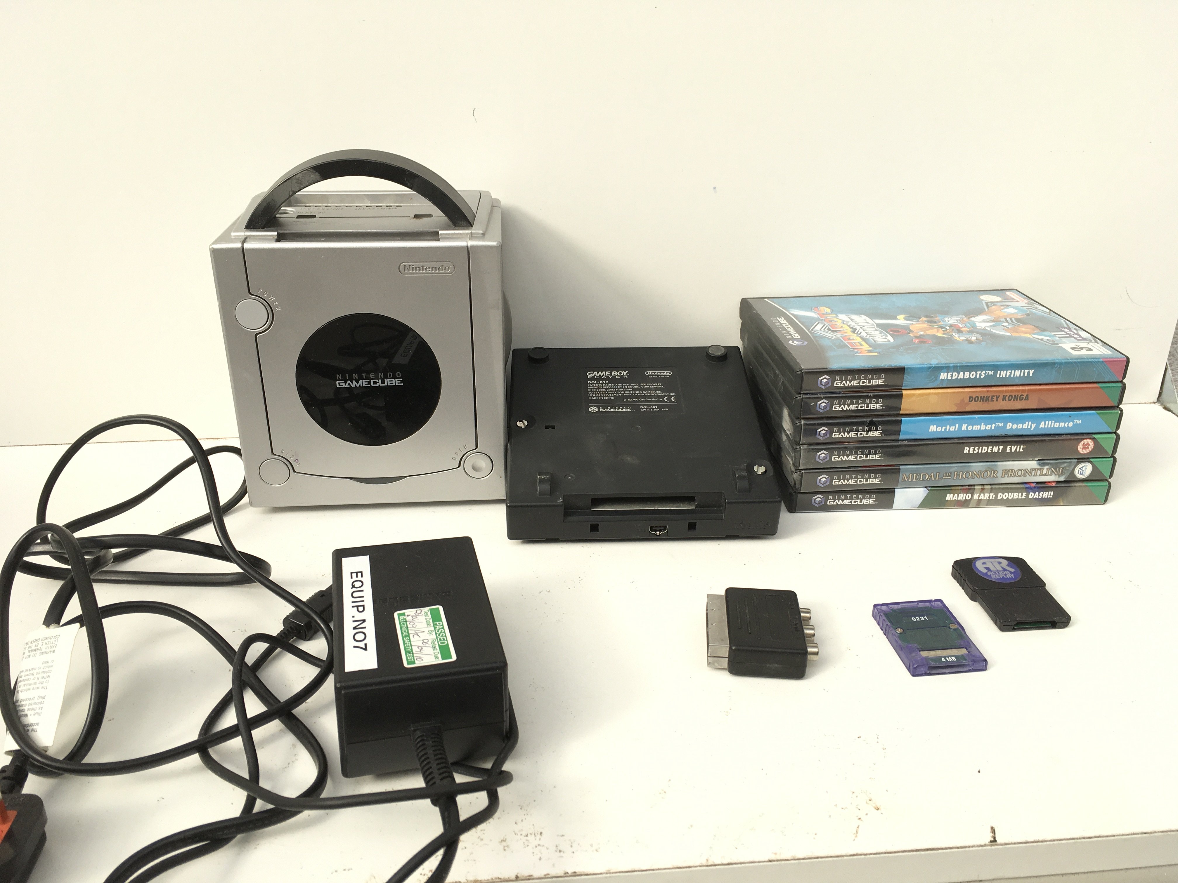 A Nintendo GameCube..includes gameboy player..power supply..memory cartridge and boxed games discs. No reserve.