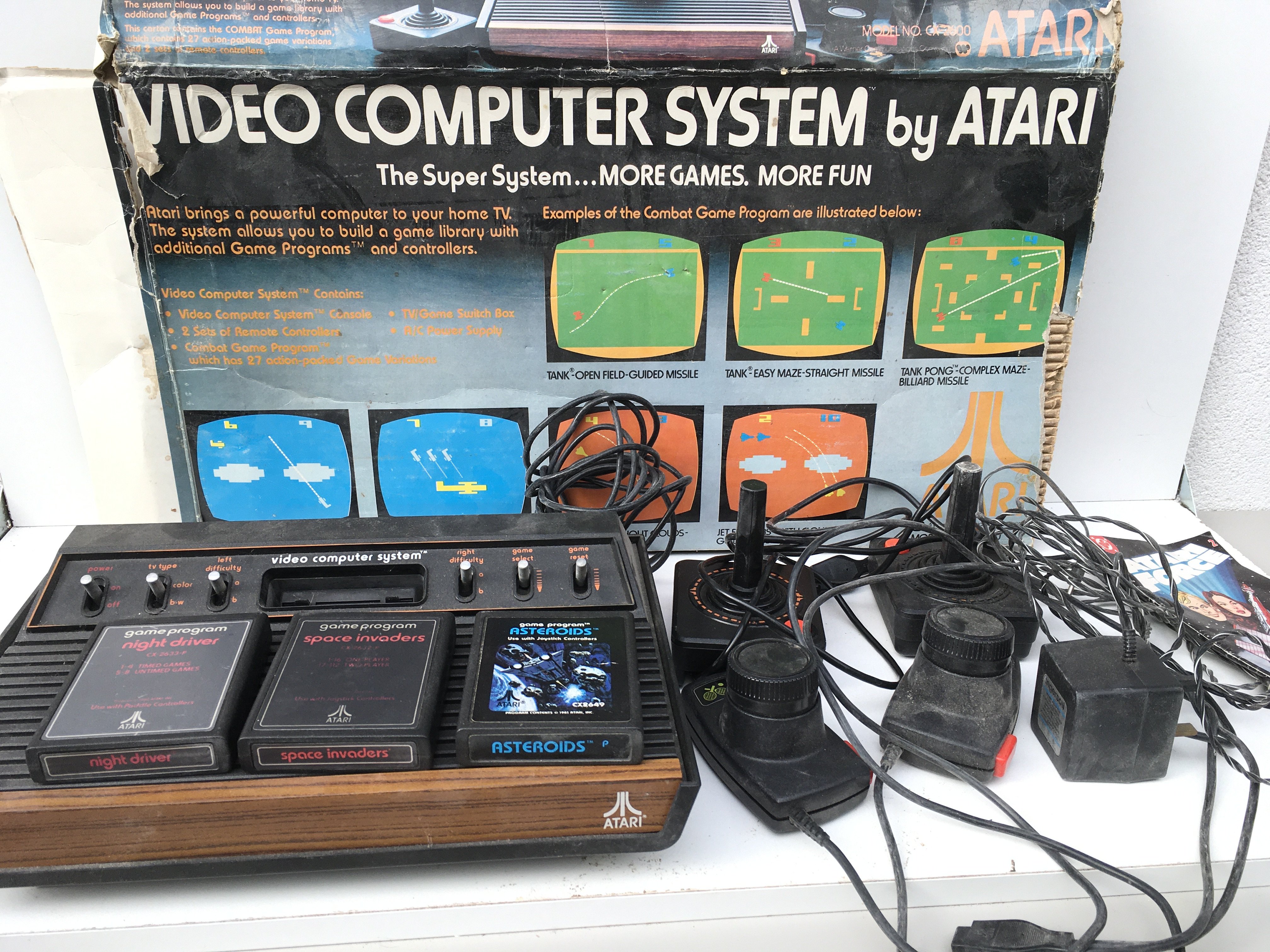 A Atari Video Computer System model CX-2600. Includes joysticks..paddles ..cables..power supply and 3 games cartridges. No reserve