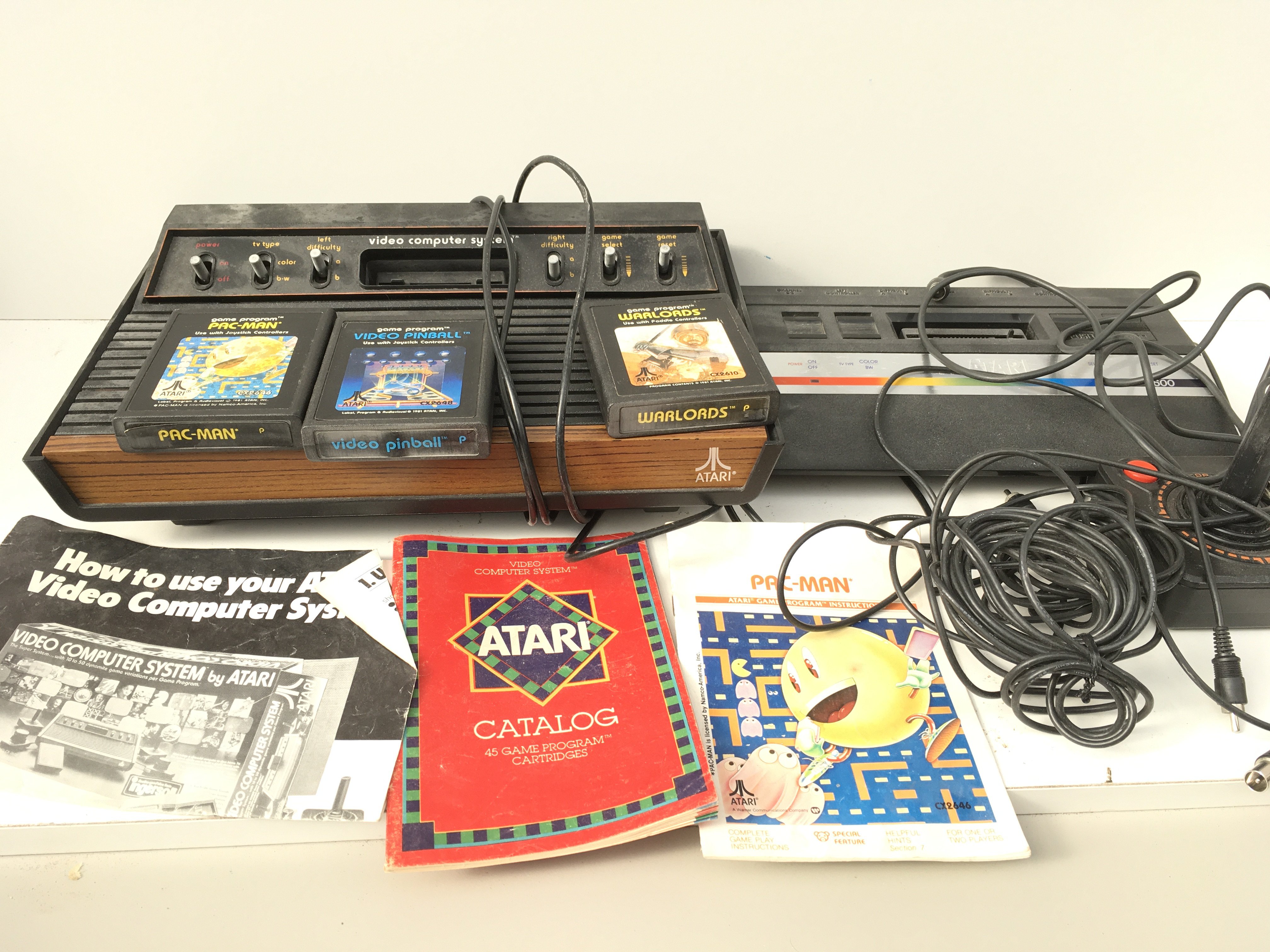 2x Atari 2600 video computer system includes manual..joystick ..cables and 3x games cartridges. No reserve