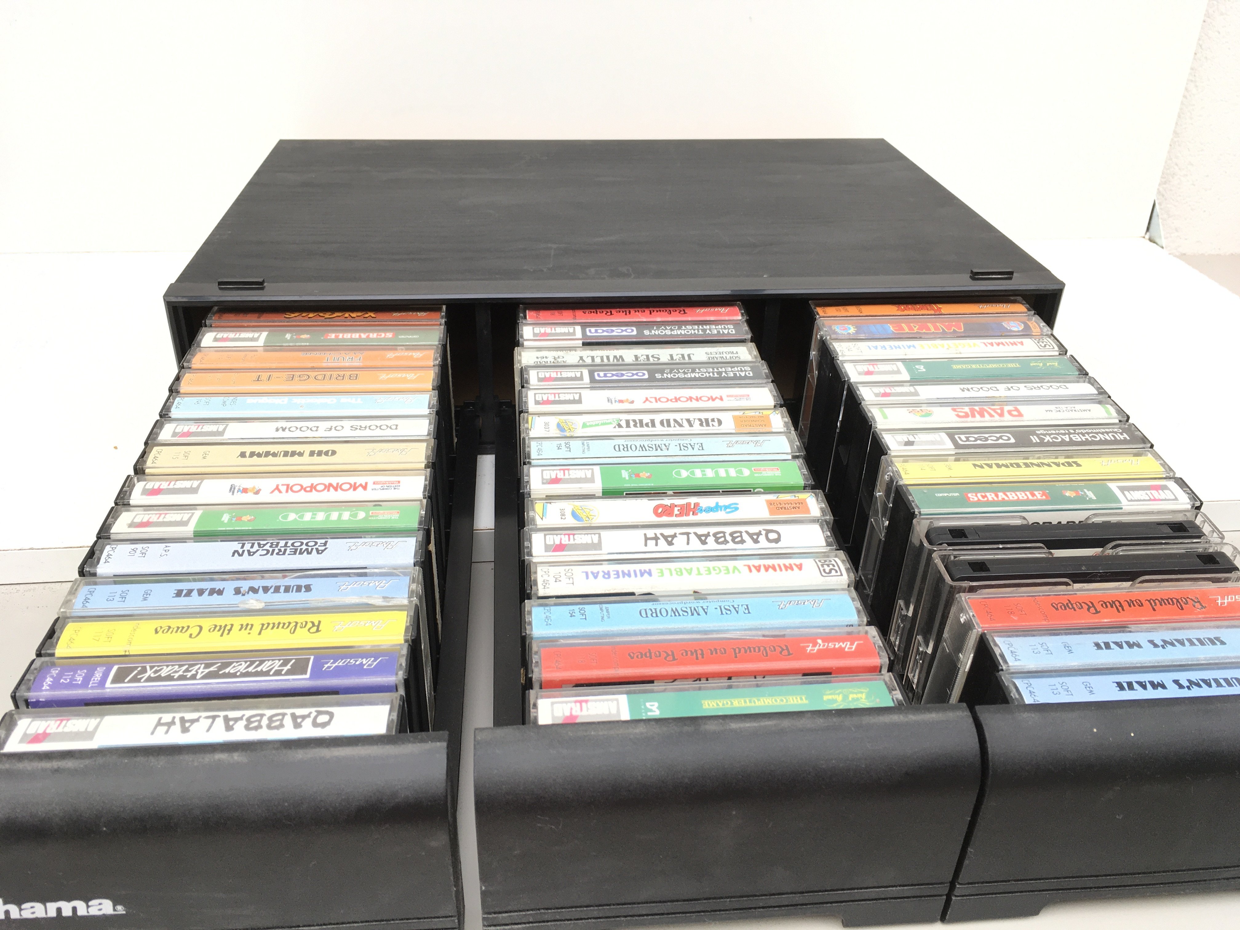 A 3 draw storage unit containing 42 boxed cassette games tapes for Amstrad computer. No reserve.