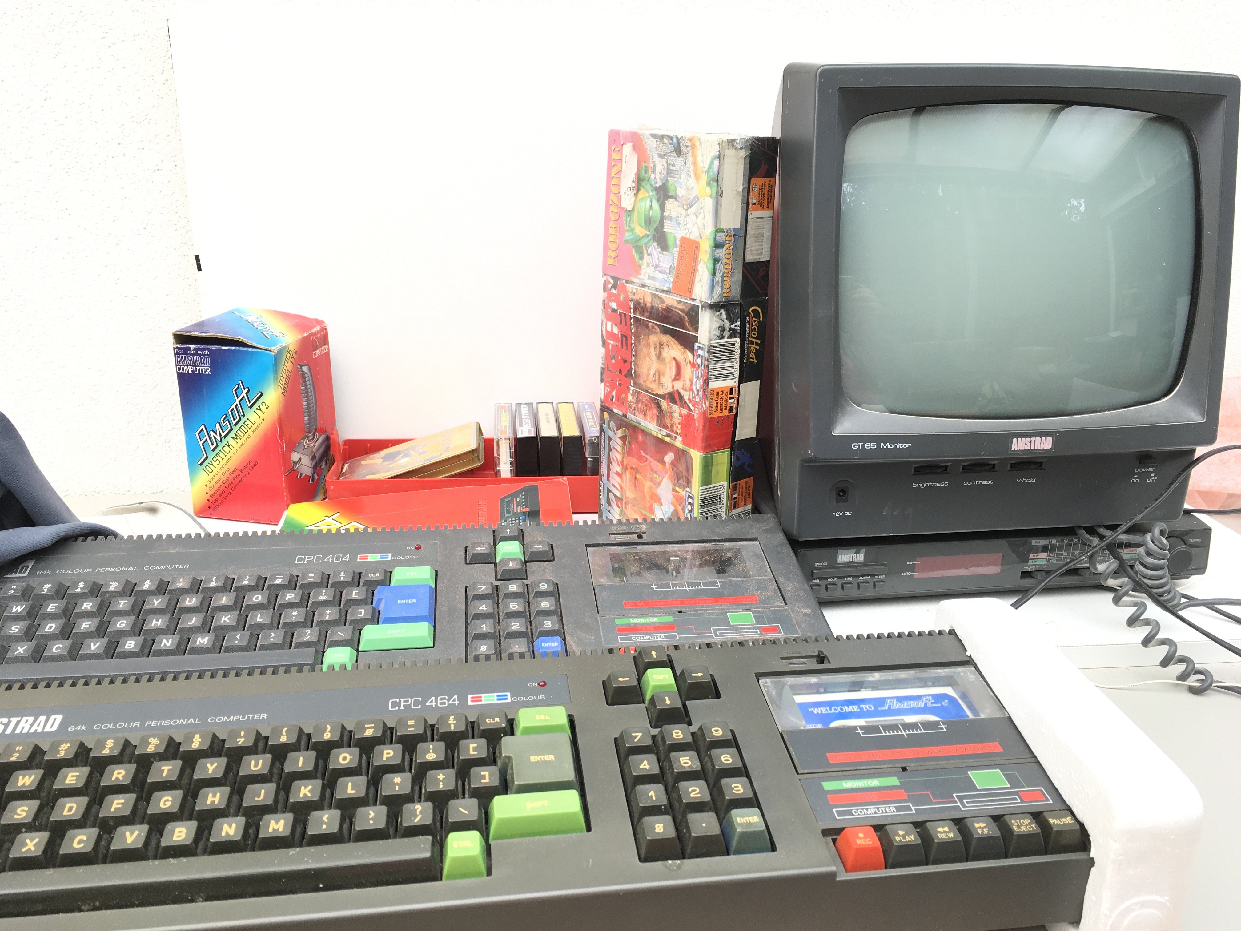 2x AMSTRAD CPC464 keyboards includes GT65 monitor..CT1 radio/ alarm..manual..cables ..joystick and games cassettes. No reserve