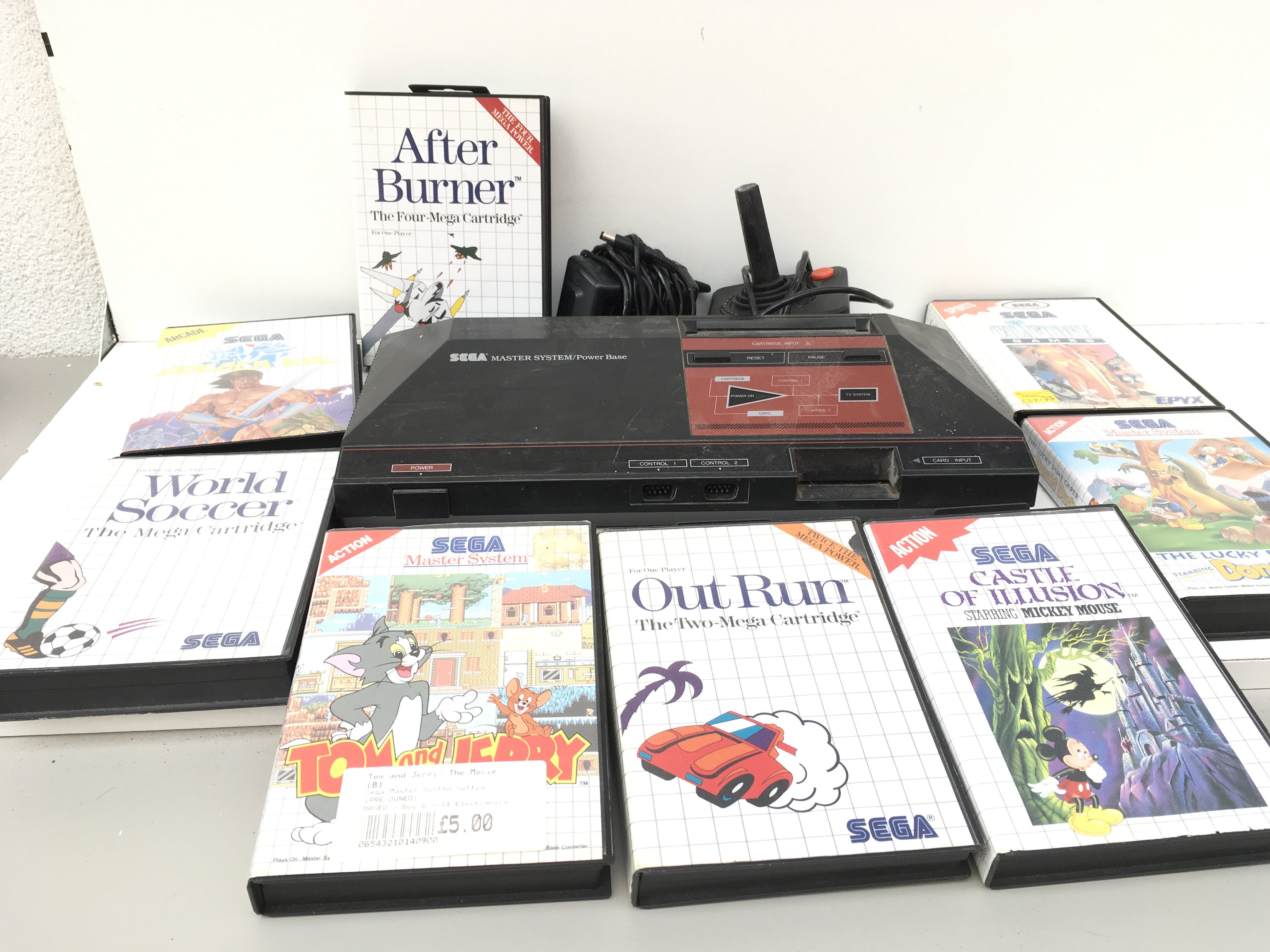 A SEGA Master System including power supply, joystick and 8 boxed games cartridge&rsquo;s. No reserve.
