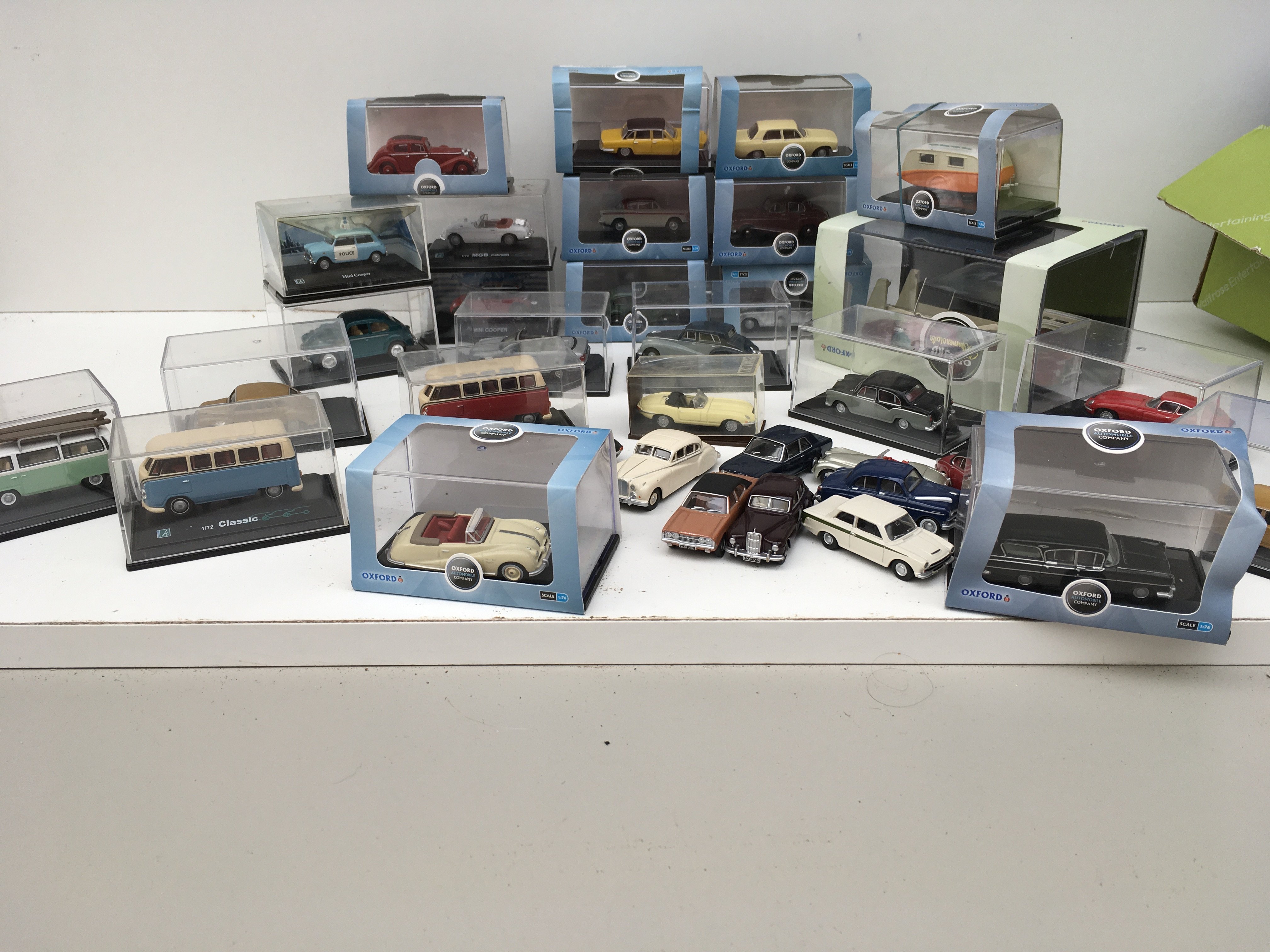 A collection in excess of 30 diecast model vehicles by Oxford..Many are with display boxes. Mainly 1:76 scale. No reserve.