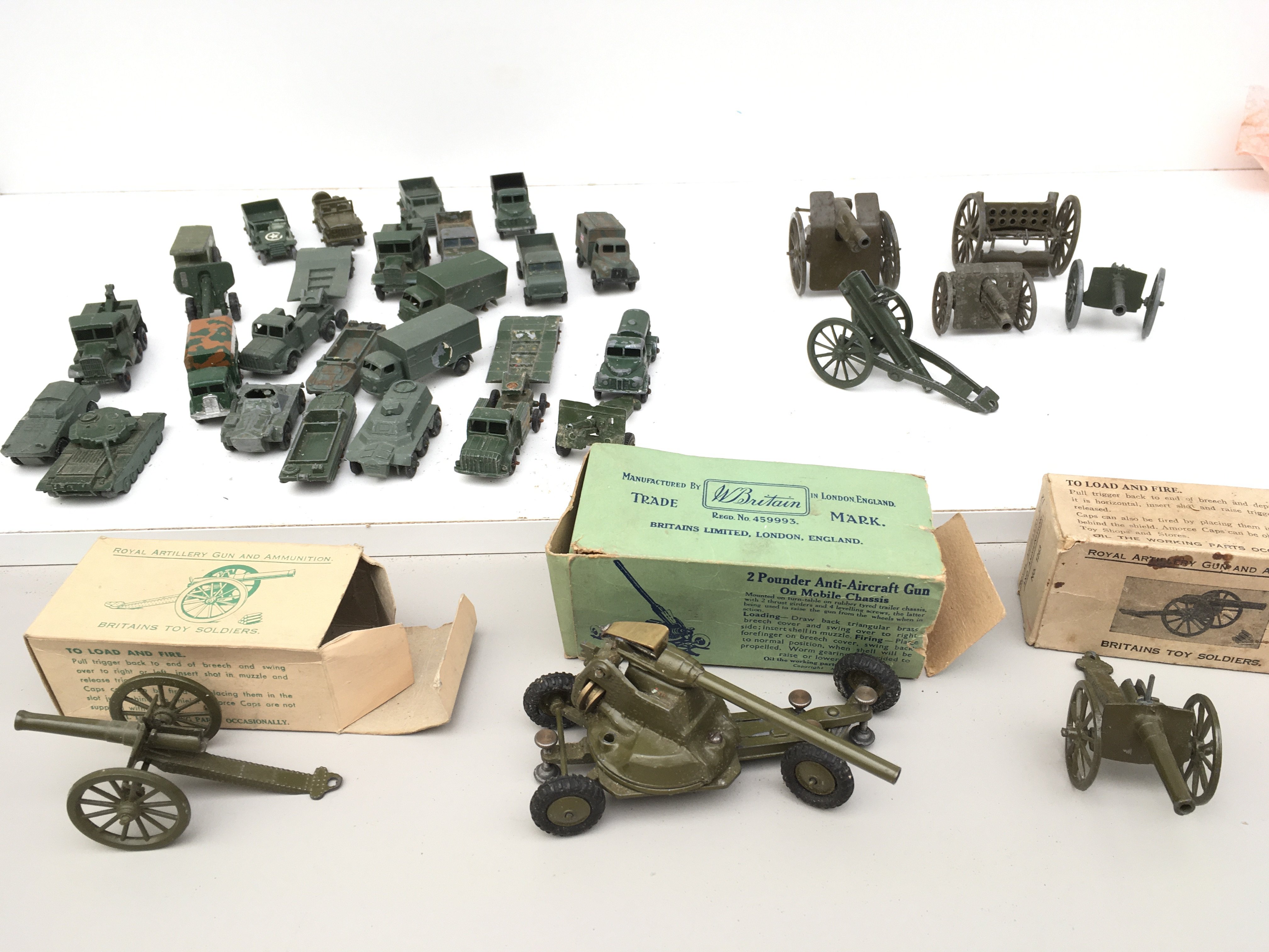 A collection of Playworn military diecast vehicles includes 3 boxed items .manufacturers include Britains ..Lesney etc. no reserve