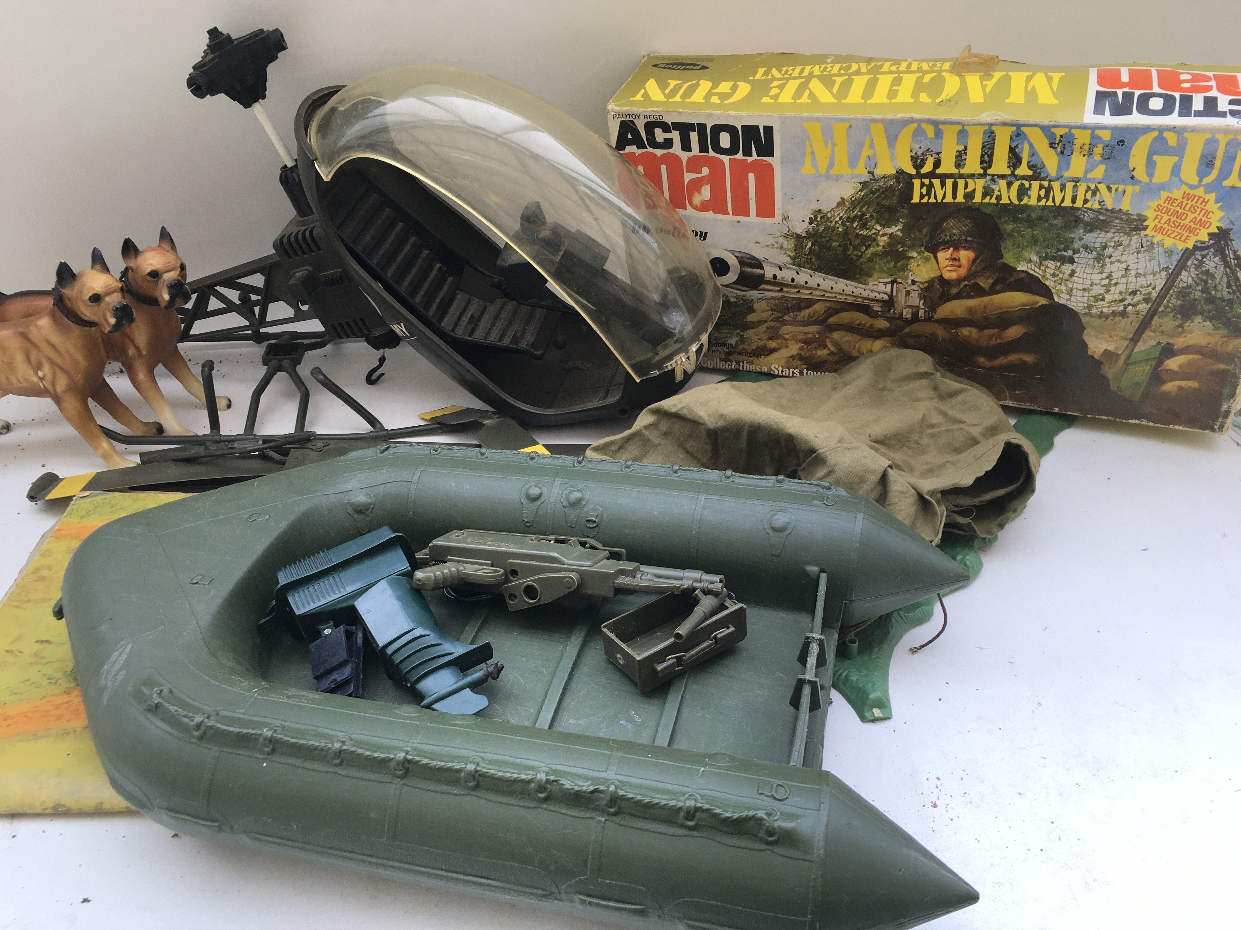 A Collection of Action Man Vehicles And accessories including a Boxed machine gun emplacement And Training Tower. Dogs. Guns etc. Ideal for Spare Parts.No reserve. (2).