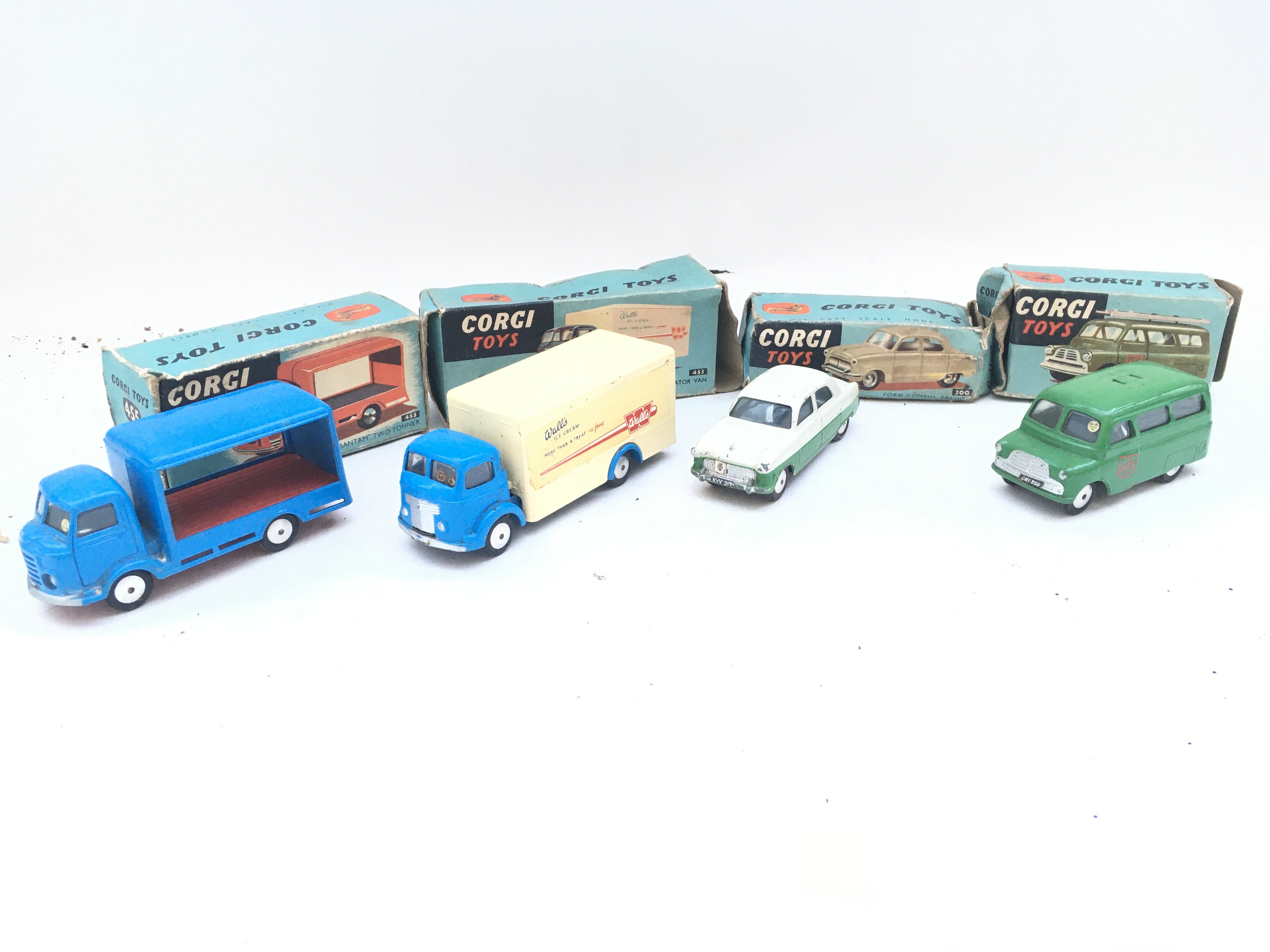 4 Boxed Corgi Toys. A Karrie Bantam Two Tonner #455. A Commer Walls Refrigerator Van #453. A Ford Consul Saloon #200 and a Bedford Utilecon AFS Tender #405 ( Missing Ladder). Boxes In Various States.