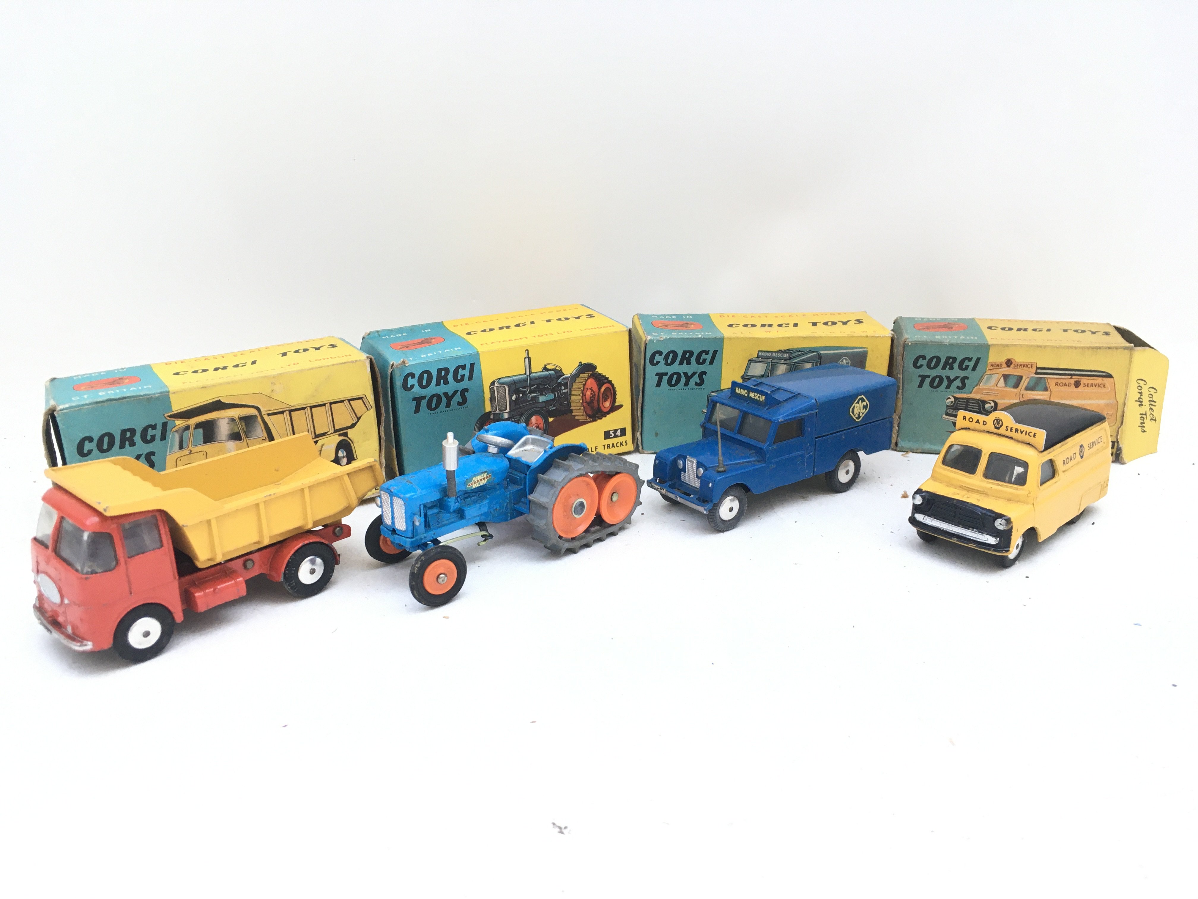 4 Boxed Corgi Vehicles. A E.R.F. Model 64G Earth Dumper #458. A Fordson Power Major Half Track #54. A R.A.C. Radio Rescue Land Rover #416 and a Bedford Road Service Van #408. Boxes in Various States.