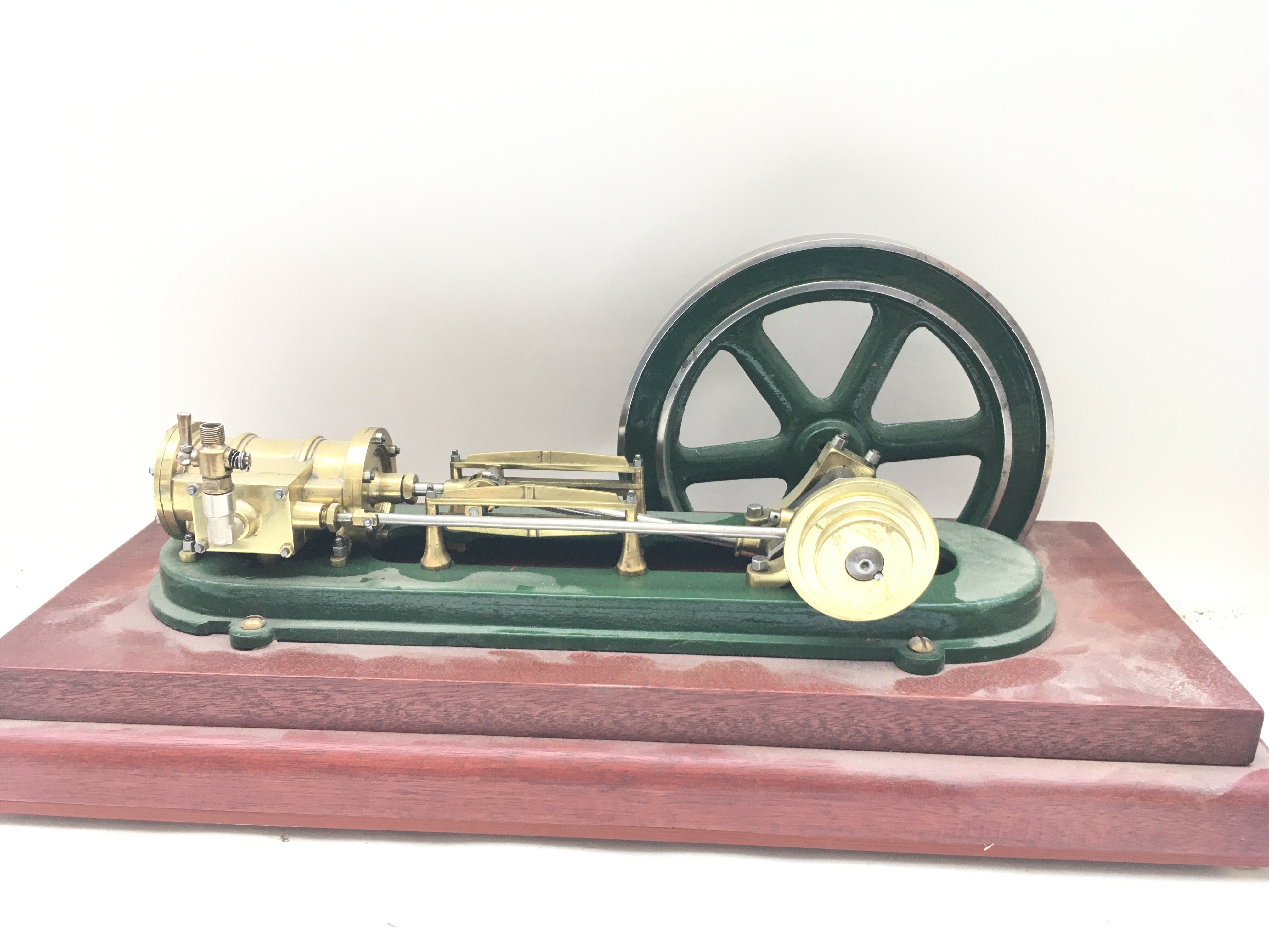 A Vertical Live Steam Engine On Wooden Plinth. Approx Height 24Cm length 58CM.
