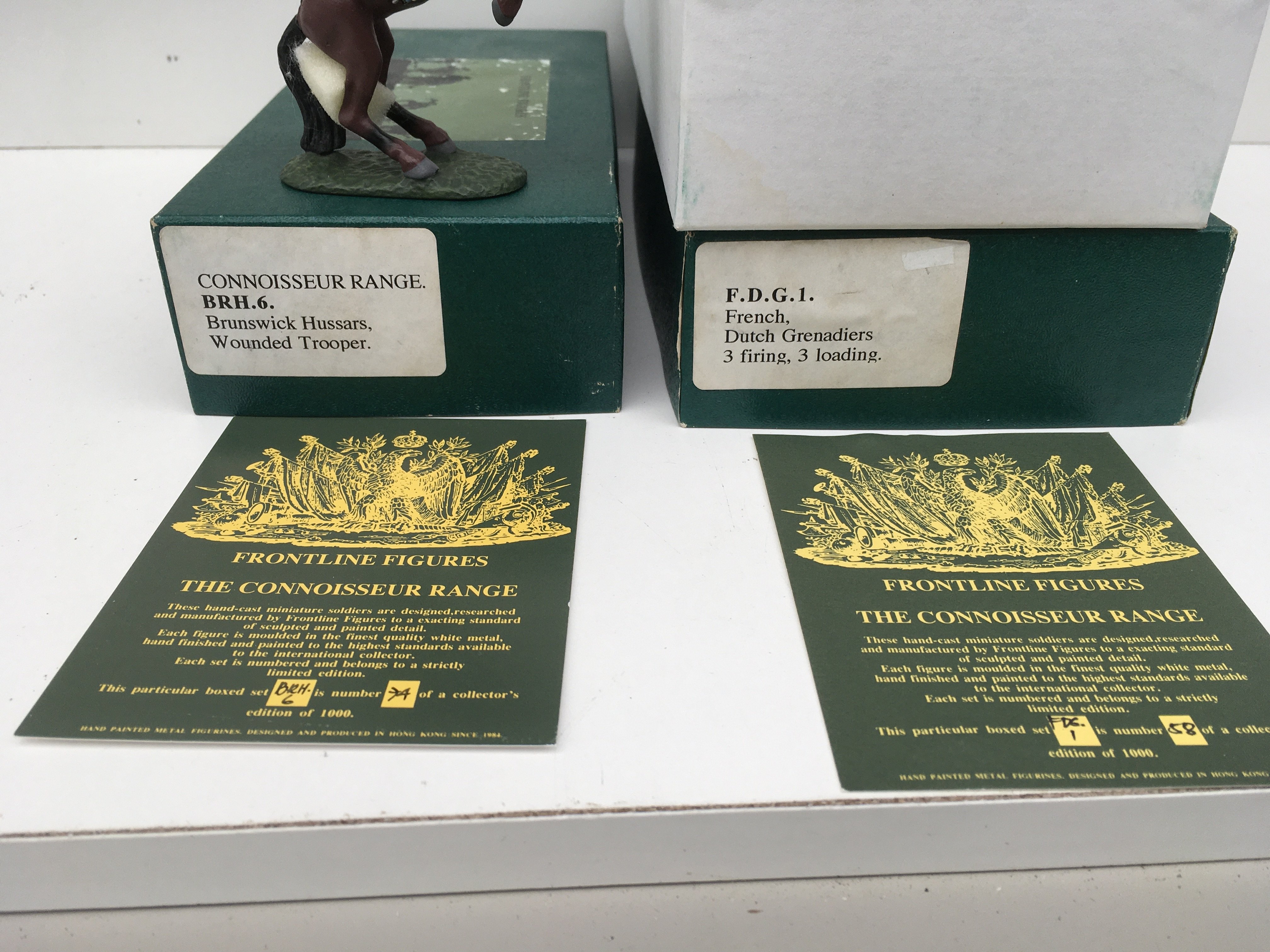 2x boxed Minature military models by Frontline Figures featuring BRH6 Wounded Trooper and FDG1 Dutch Grenadiers (6 figures). Limited editions with certificates. No reserve.