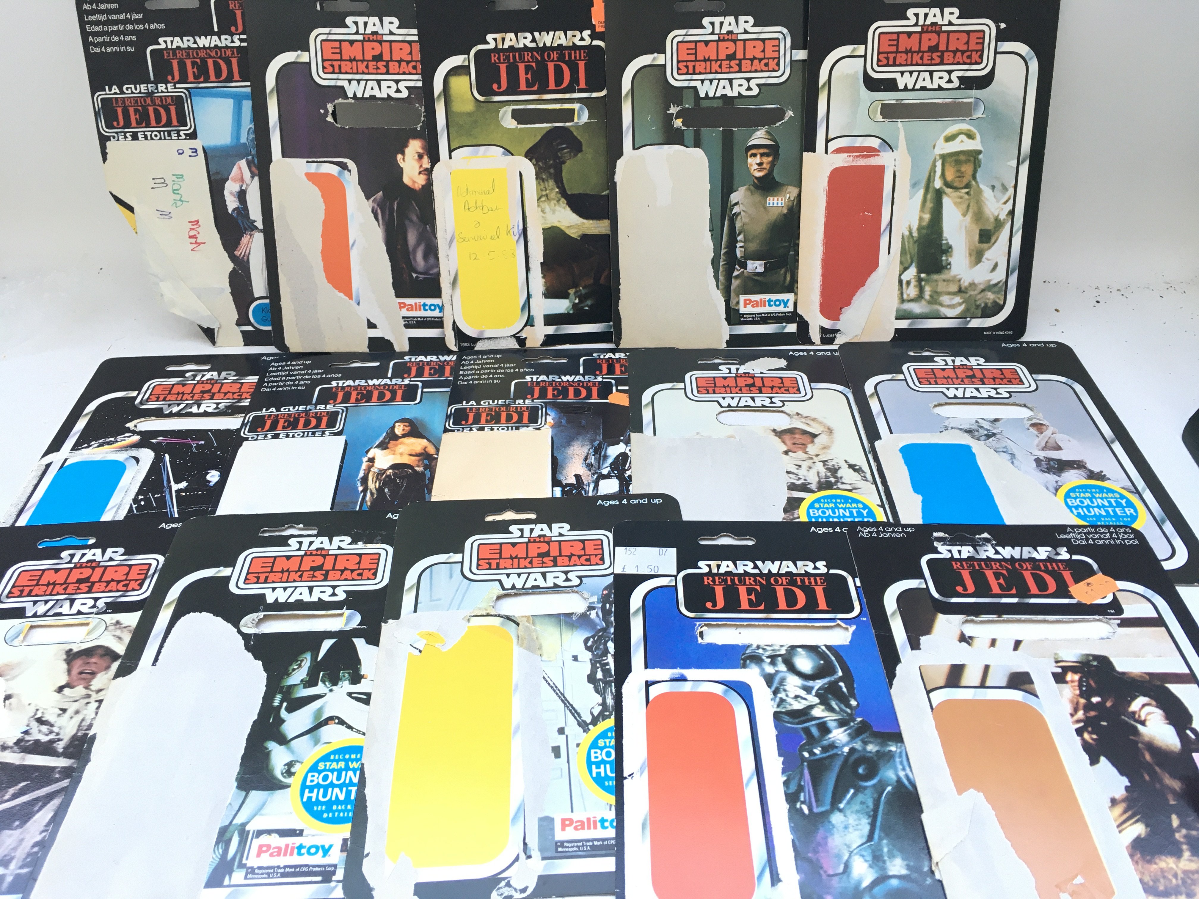 A Collection of Vintage Star Wars Backing Cards, figures and a Modern X-Wing.