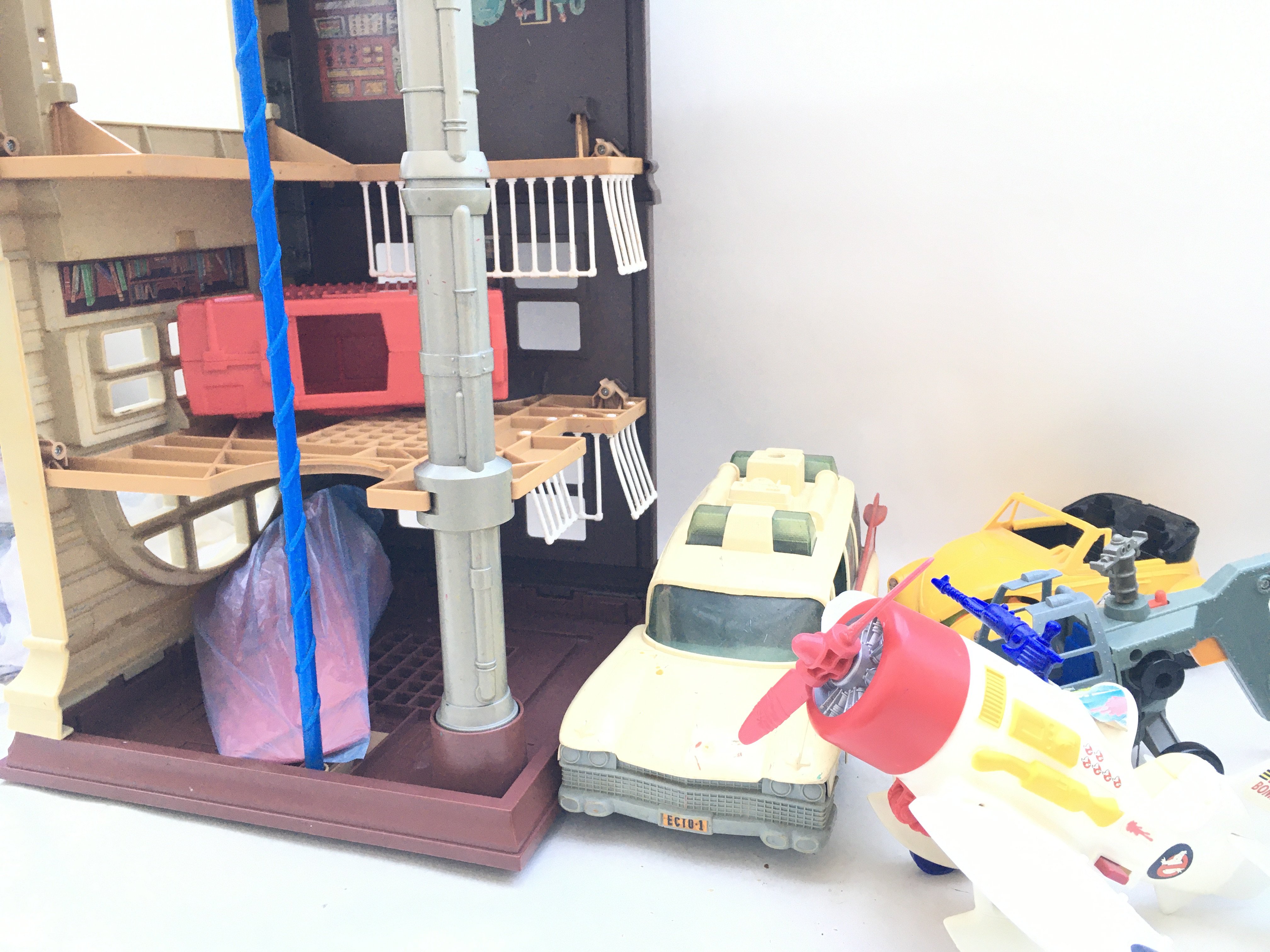 A Collection of Vintage Gostbusters Figures. A Fire House And Accessories.(2).