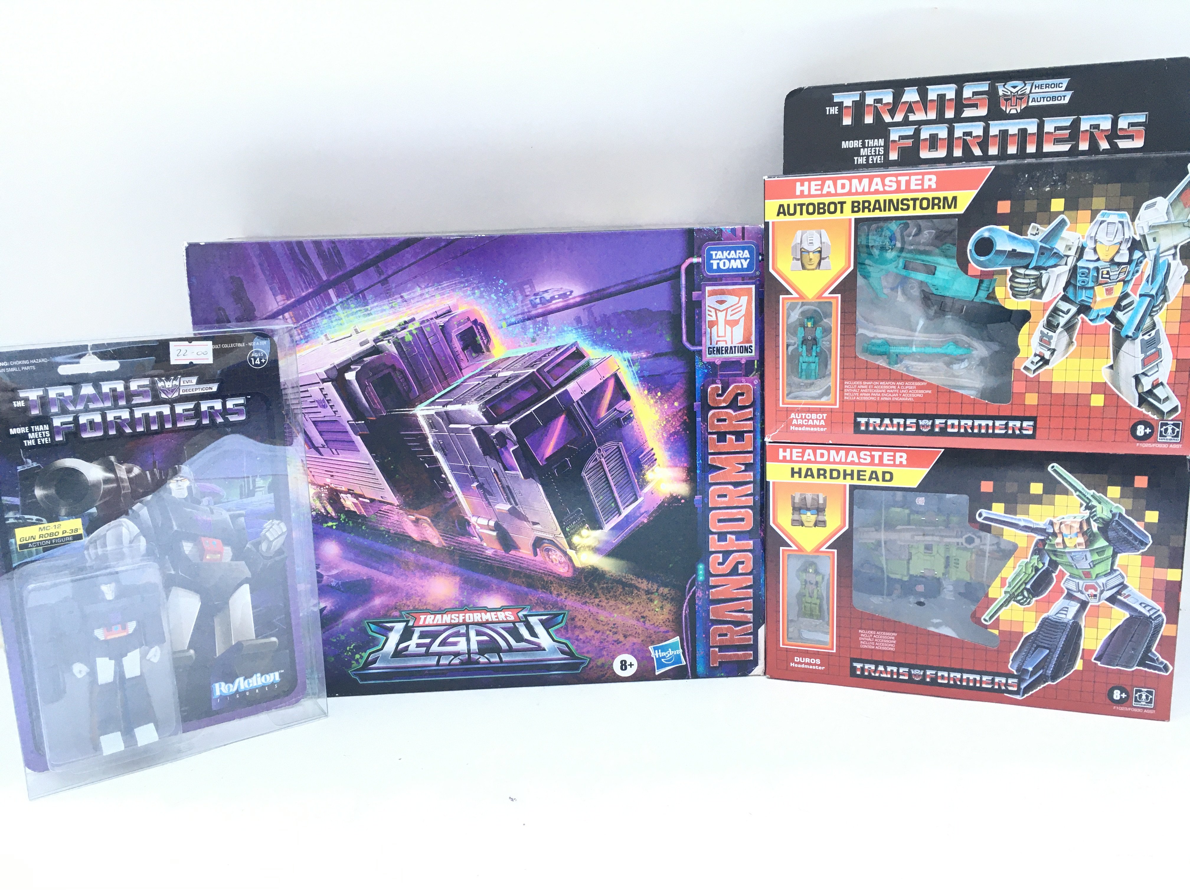 A Collection of Various Boxed And Loose Transformers.