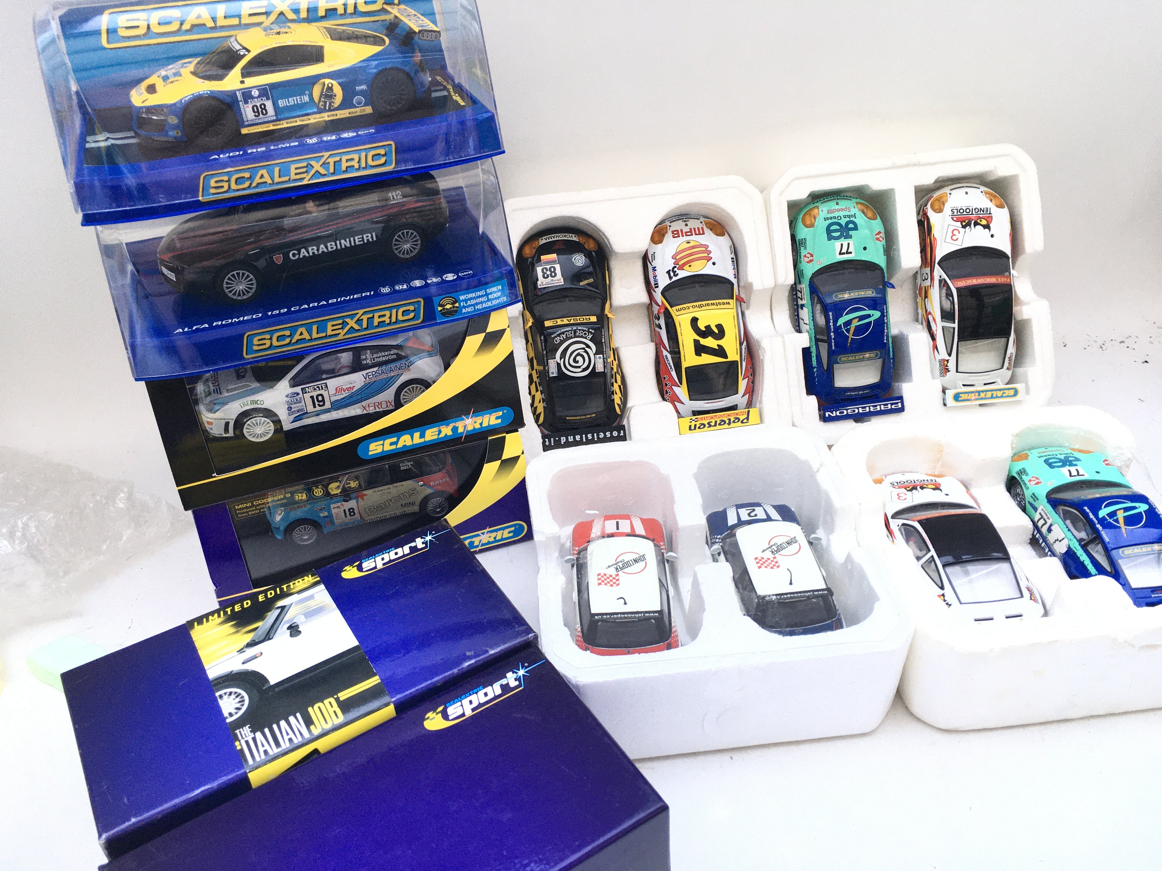 A Collection of Boxed Scalextric Cars. 14 in total