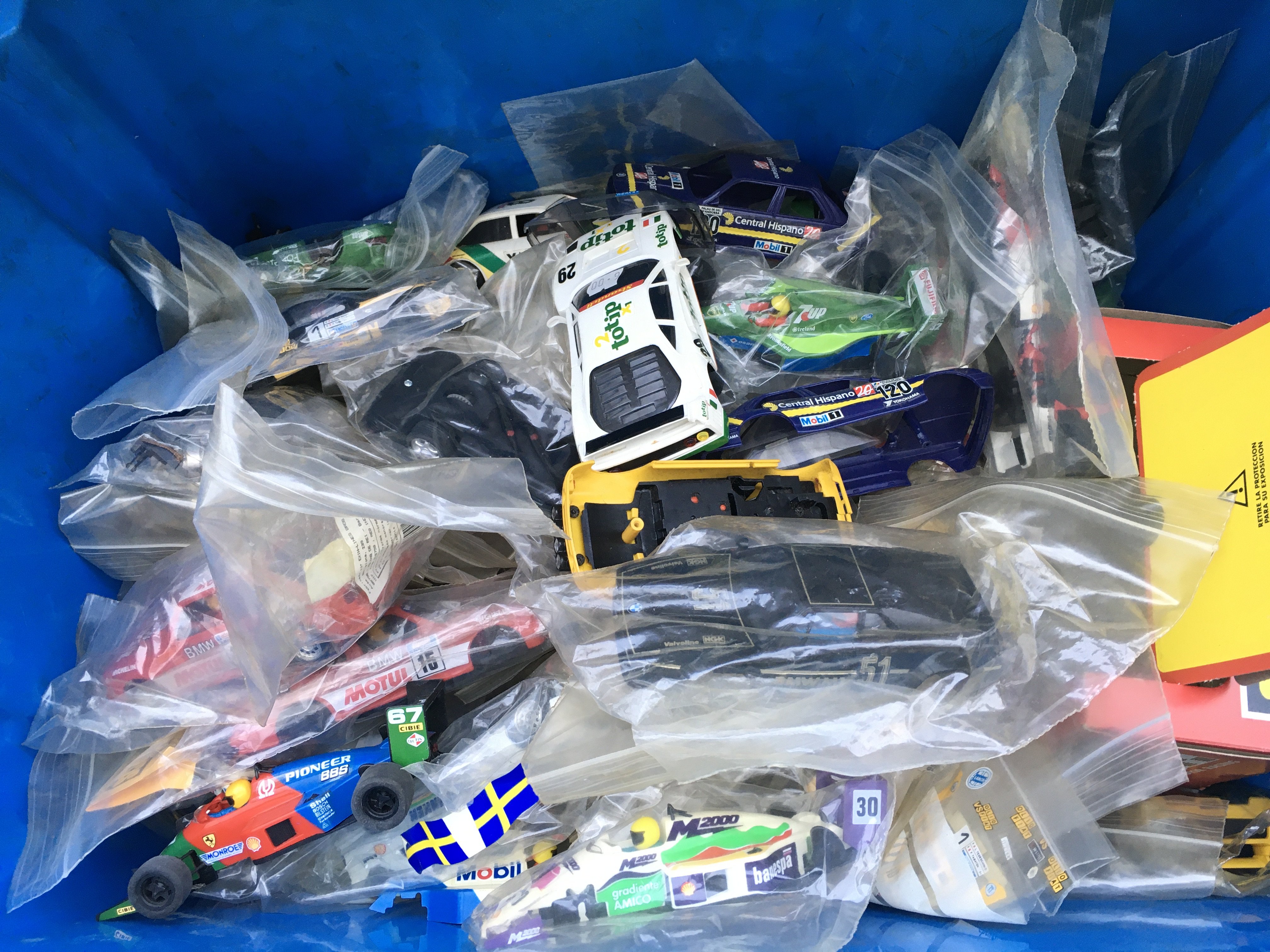 A Box Containing Scalextric Cars Spare And Repairs.