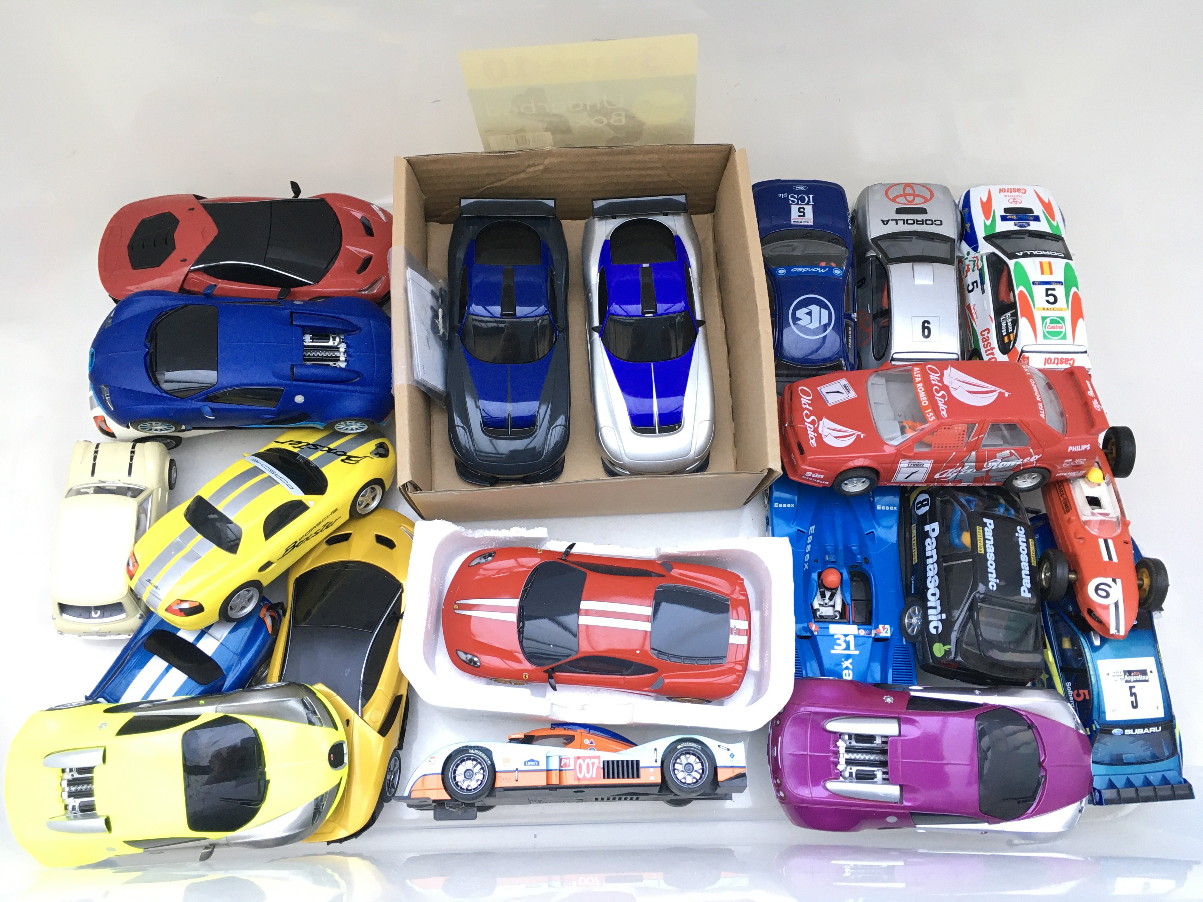 A Box Containing A Collection Of Scalextric Cars.
