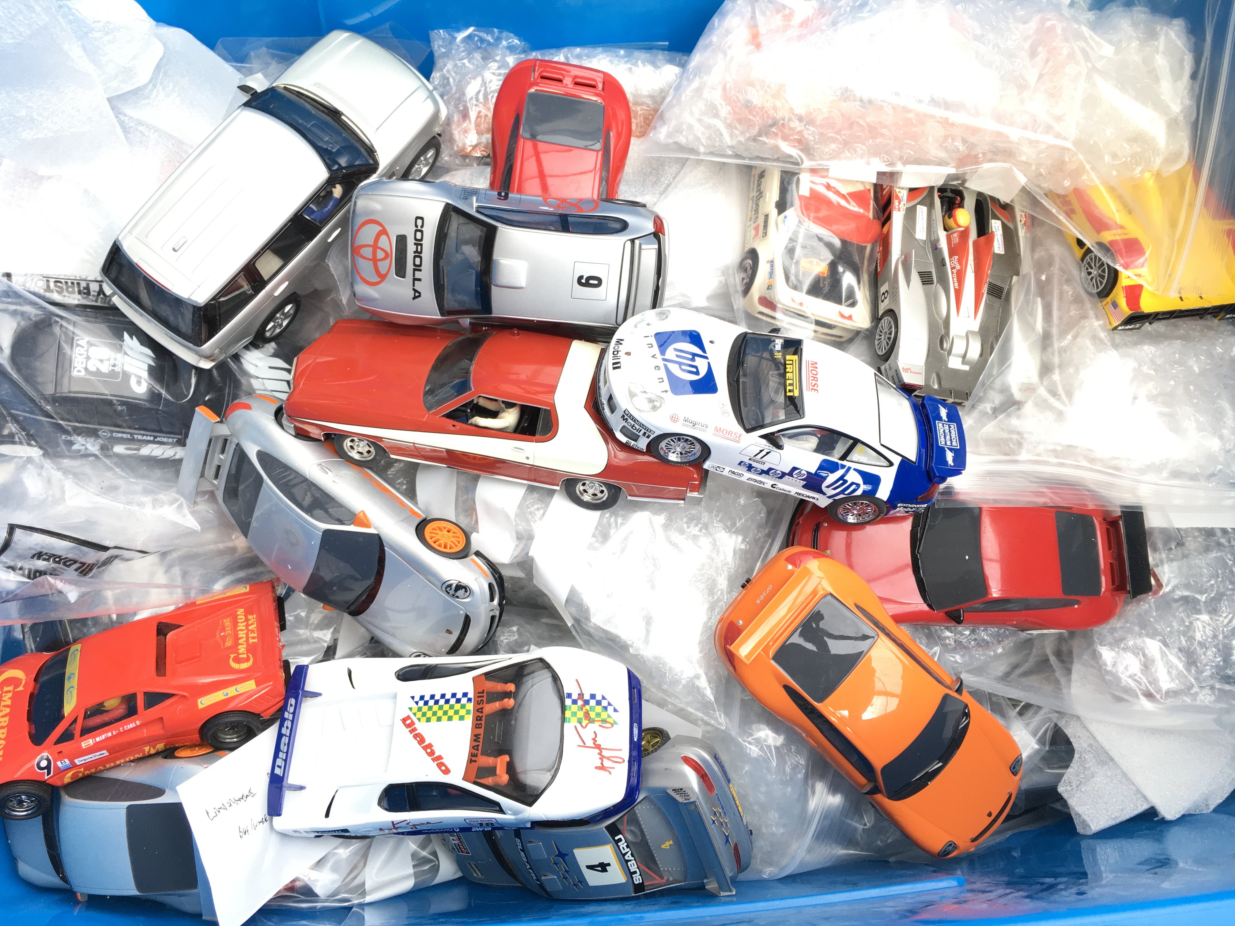 A Box Containing A Collection of Scalextric Cars. Ideal ForSpares And Repairs.