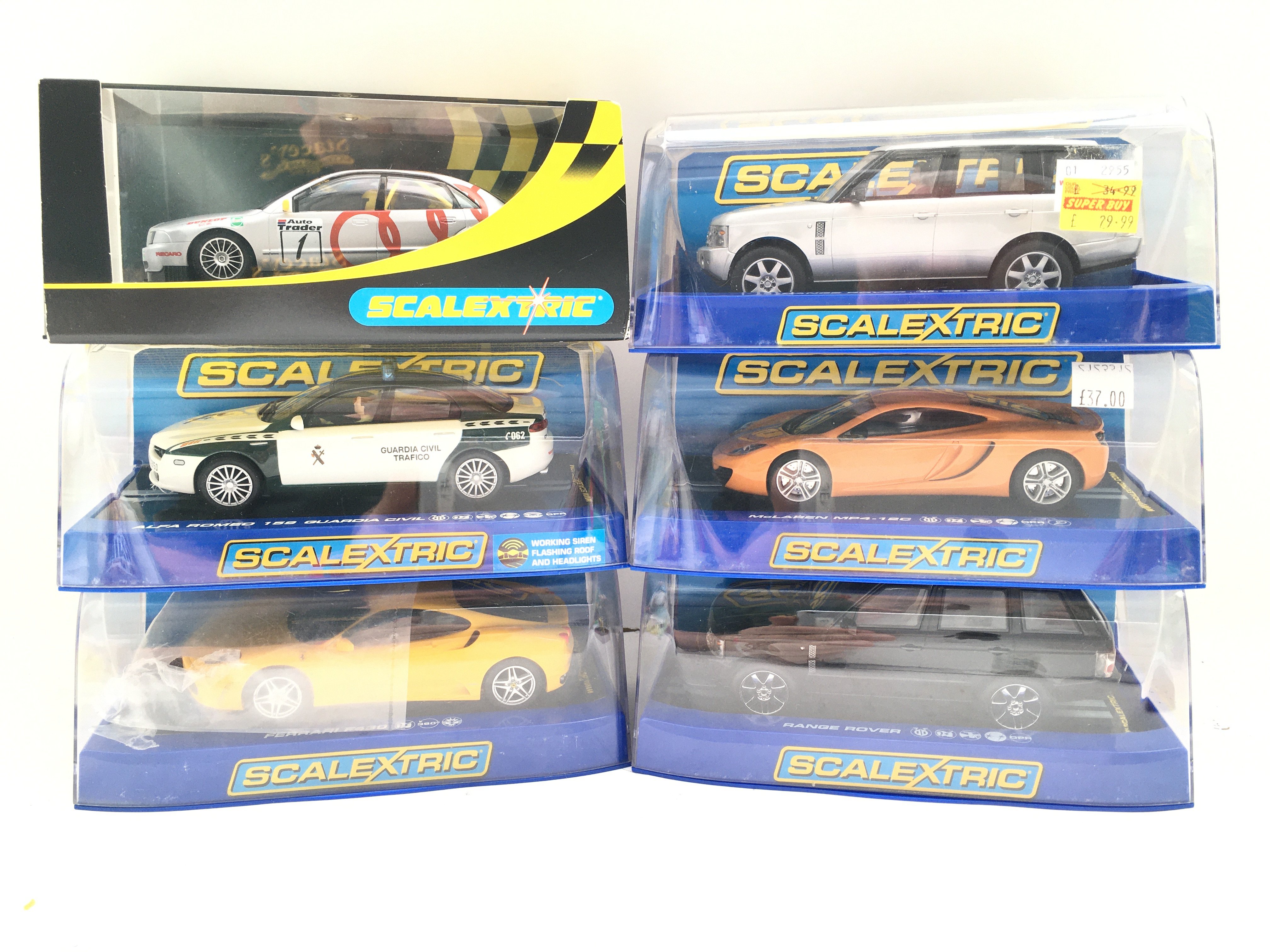 6 Boxed Scalextric Cars. Including 2 Range Rovers. McLaren MP4-12C. A Ferrari F430. A Alfa Romeo 159 and A Audi A4.