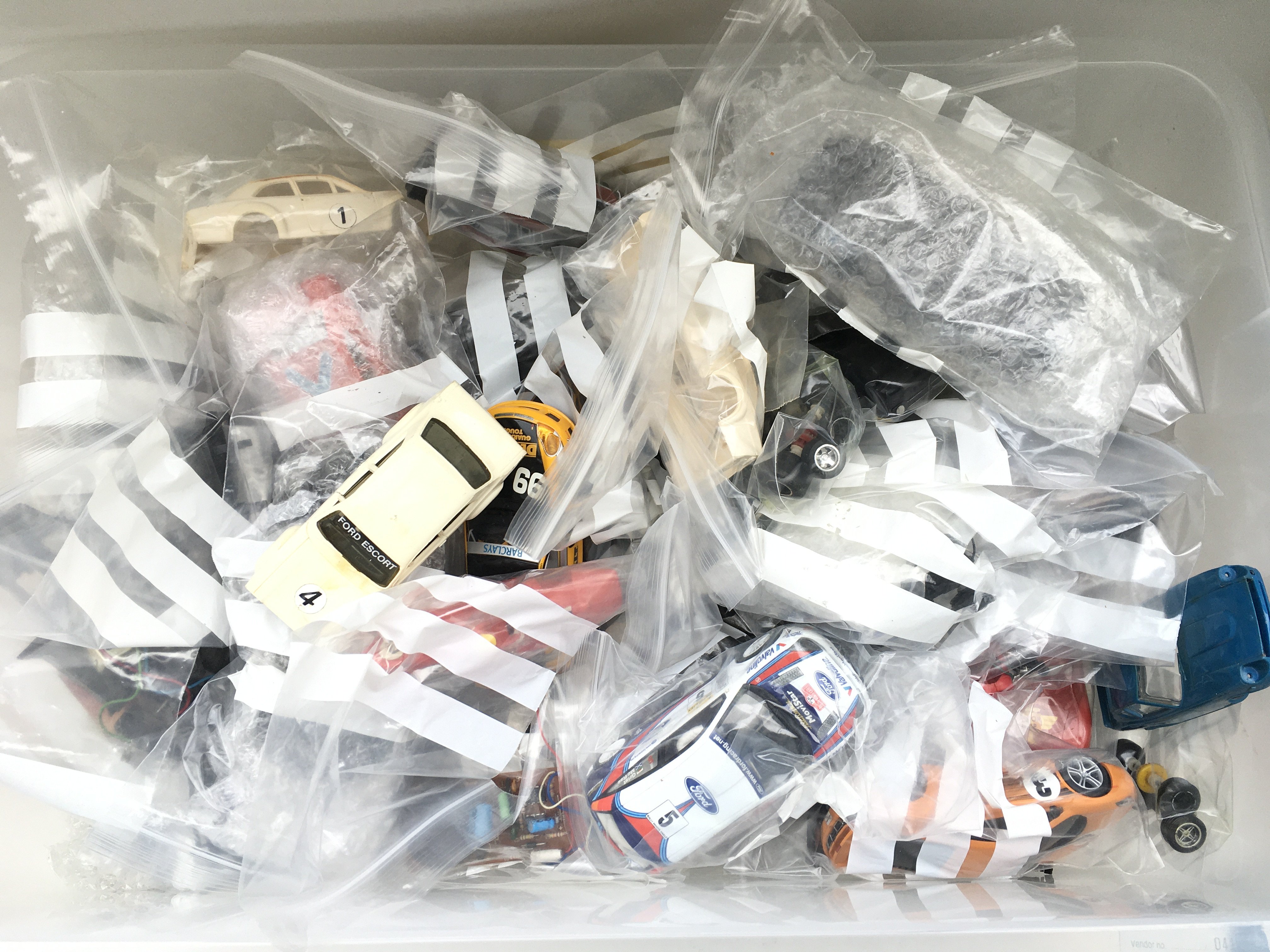 A Box Containing Scaextric Parts And Spares.