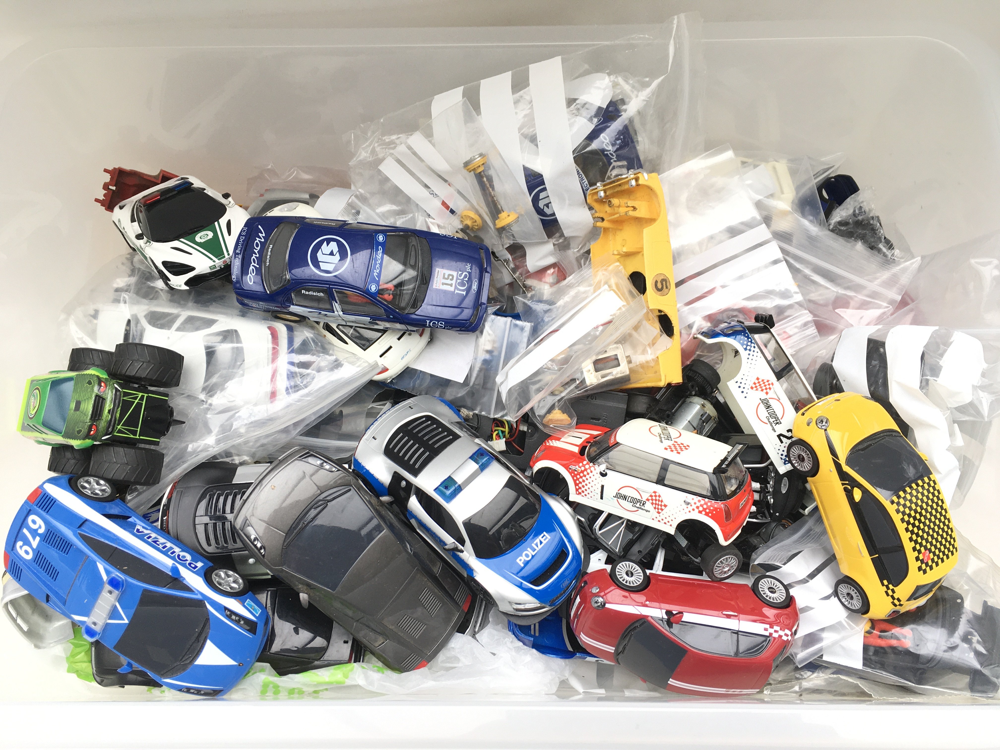 A Box Containing Scalextric Cars and Spare Parts.