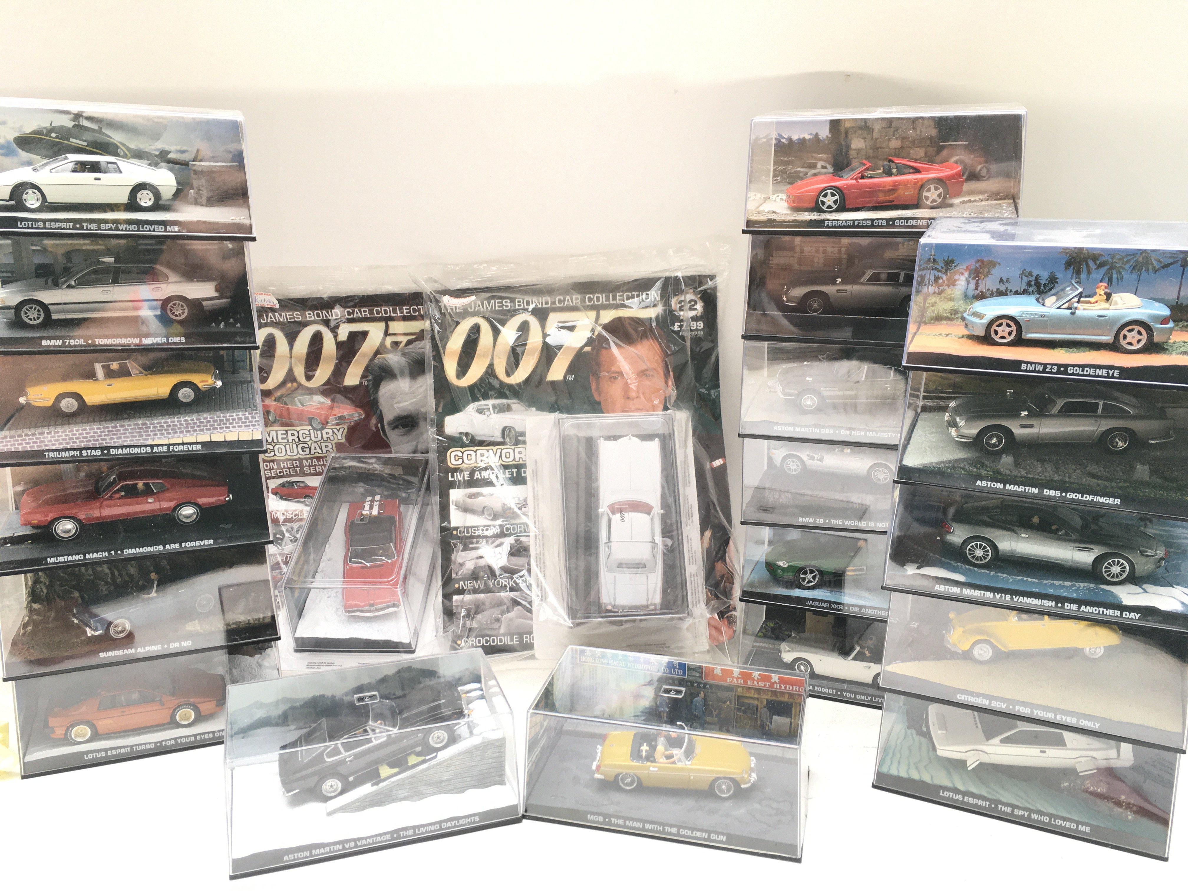 A Box Containing Part of The James Bond Car Collection And part Of the Batman Automobile Car Collection.