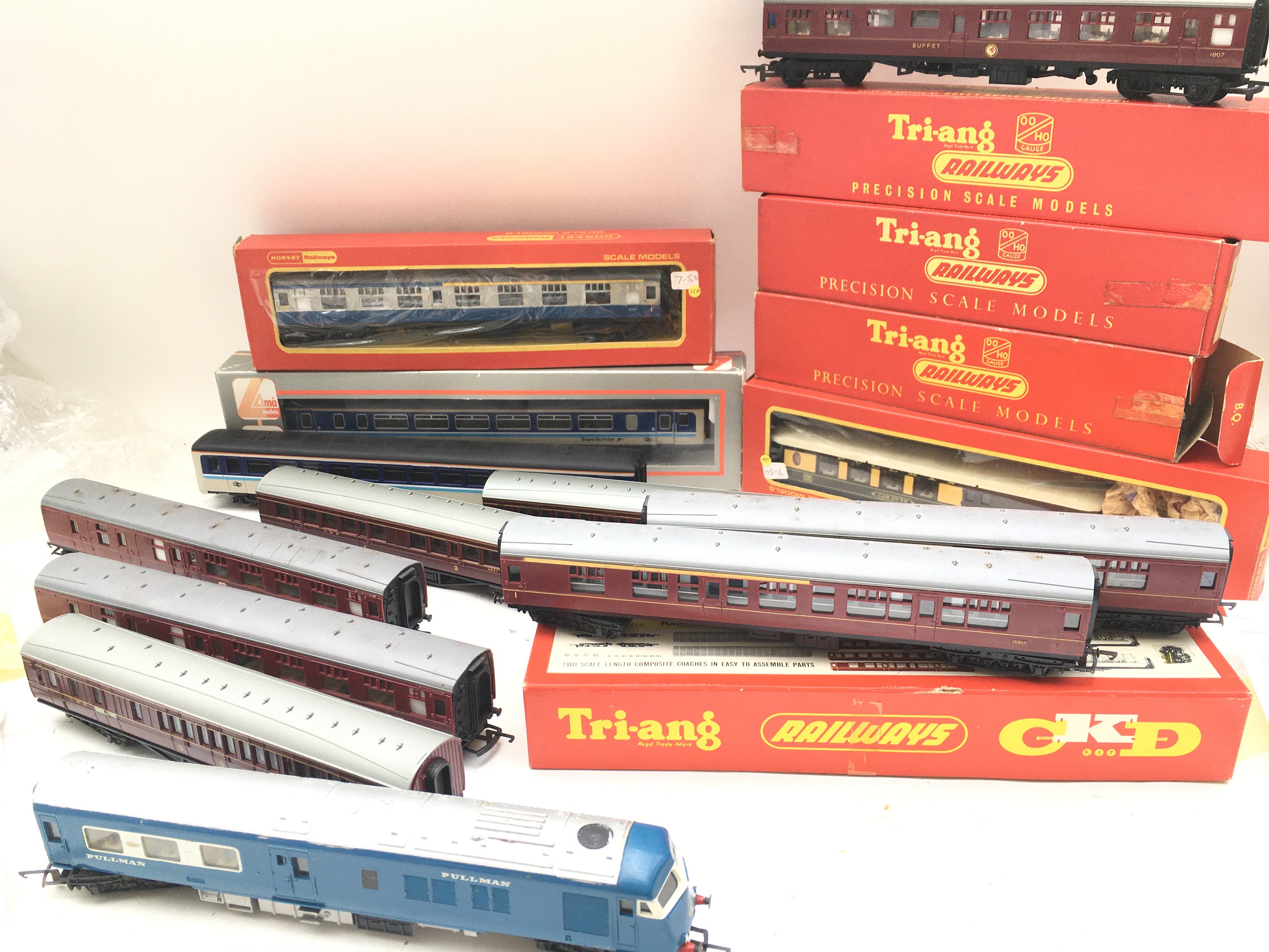 A Collection of Boxed And Loose 00 Gauge Coaches And 2 Boxed Level Crossings No Reserve.