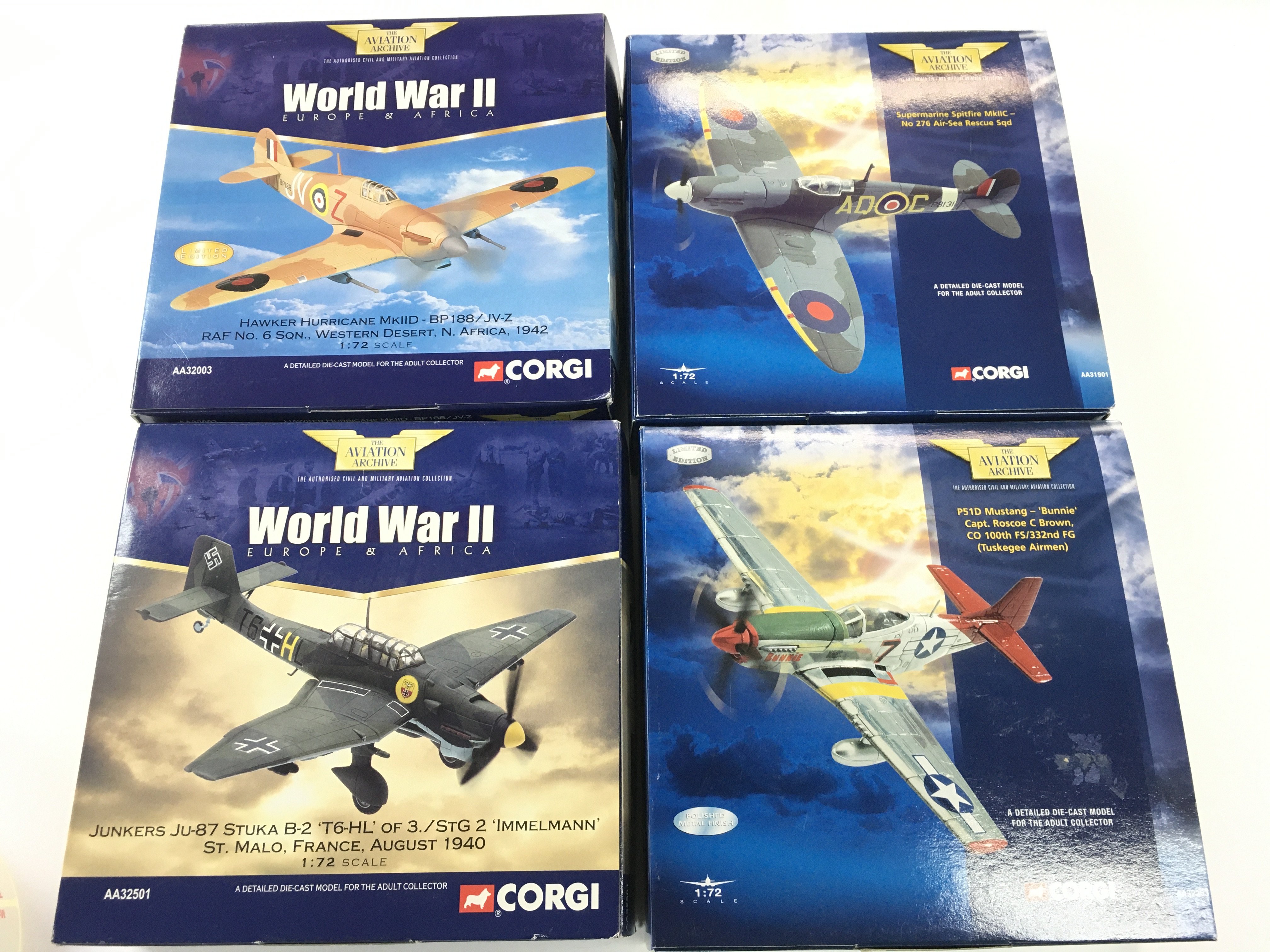 4 X Boxed Corgi Aviation Aircraft. A Junkers JU-87. A P51D Mustang. A Supermarine Spitfire And A Hawker Hurricane. 1/72 Scale No Reserve.