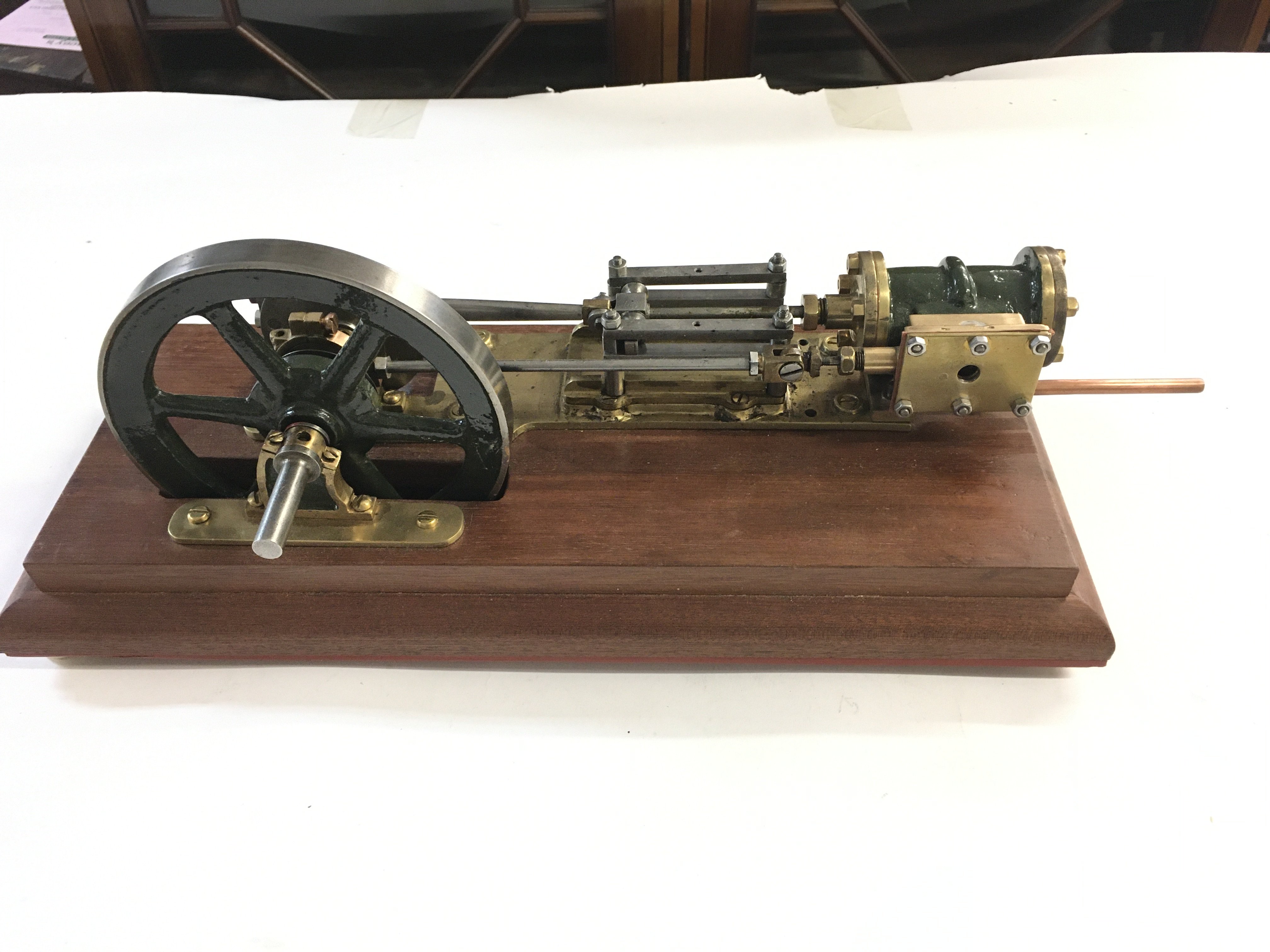 A Horizontal Steam Engine On A Wooden Plinth. Approx length 40Cm. Height 16Cm.