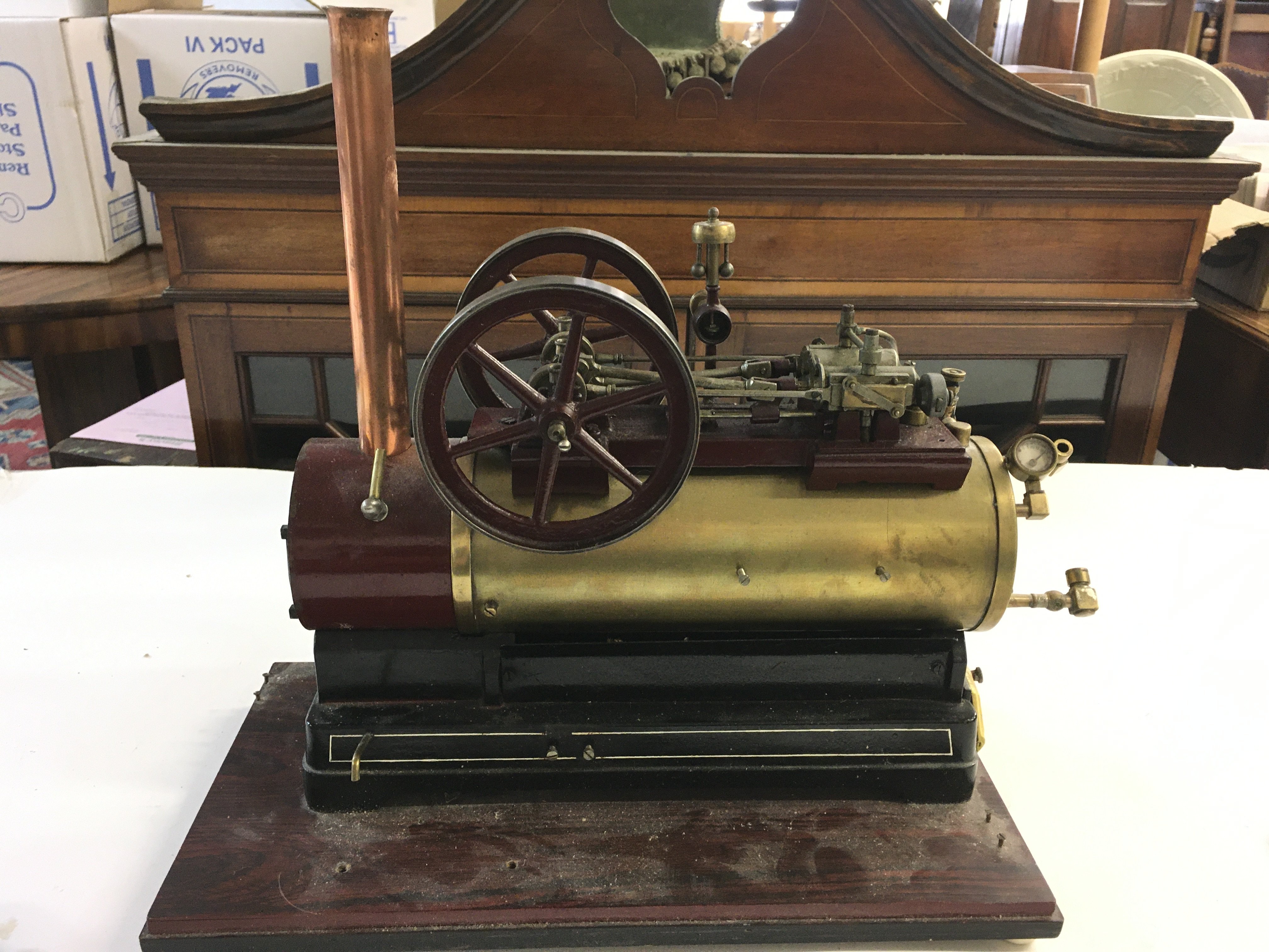 A Model Steam Boiler On Wooden Base. Approx Height 35Cm. Length 40Cm.