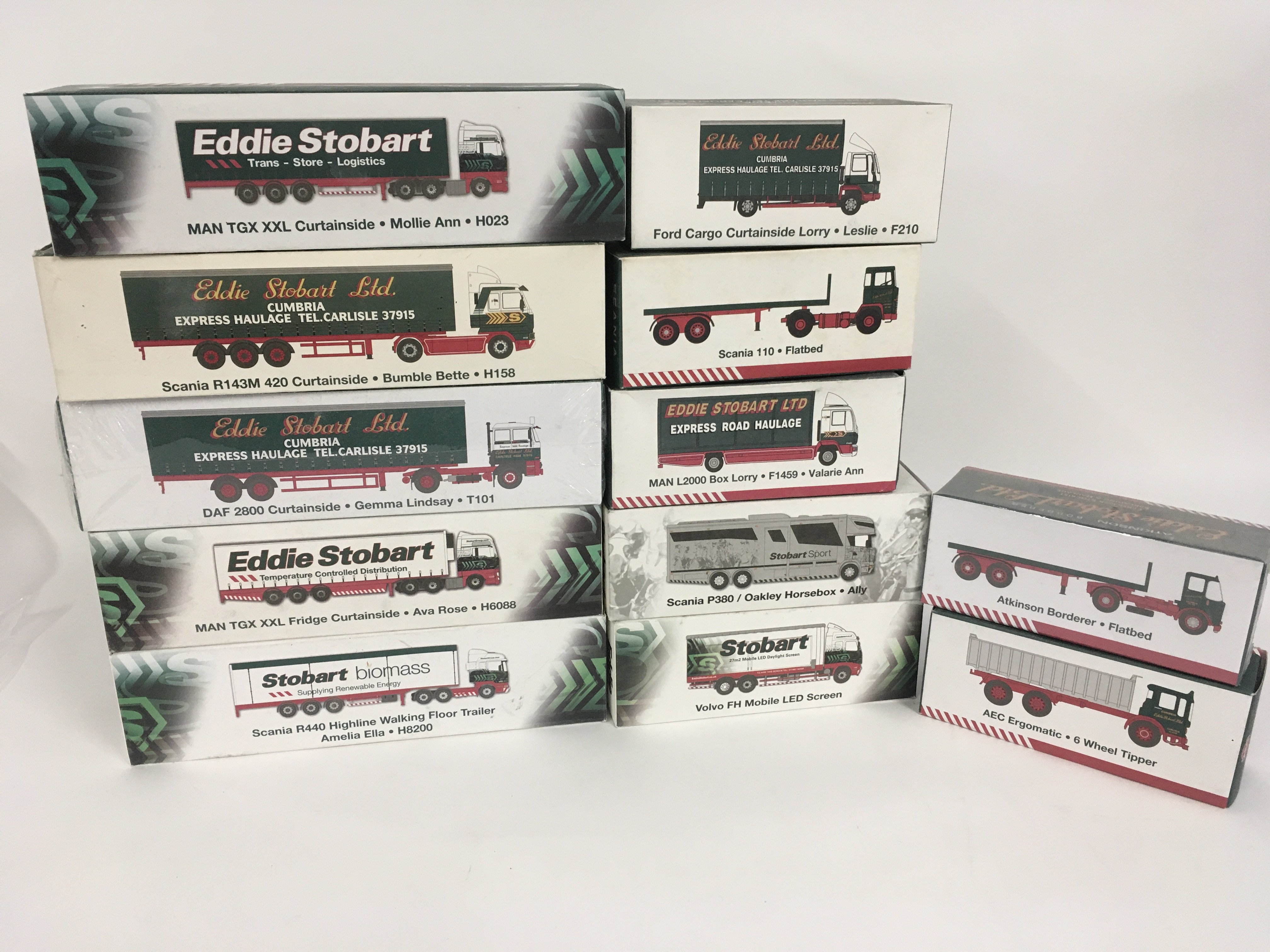 A collection of 12 boxed model trucks all in Eddie Stobart livery some sealed. No reserve