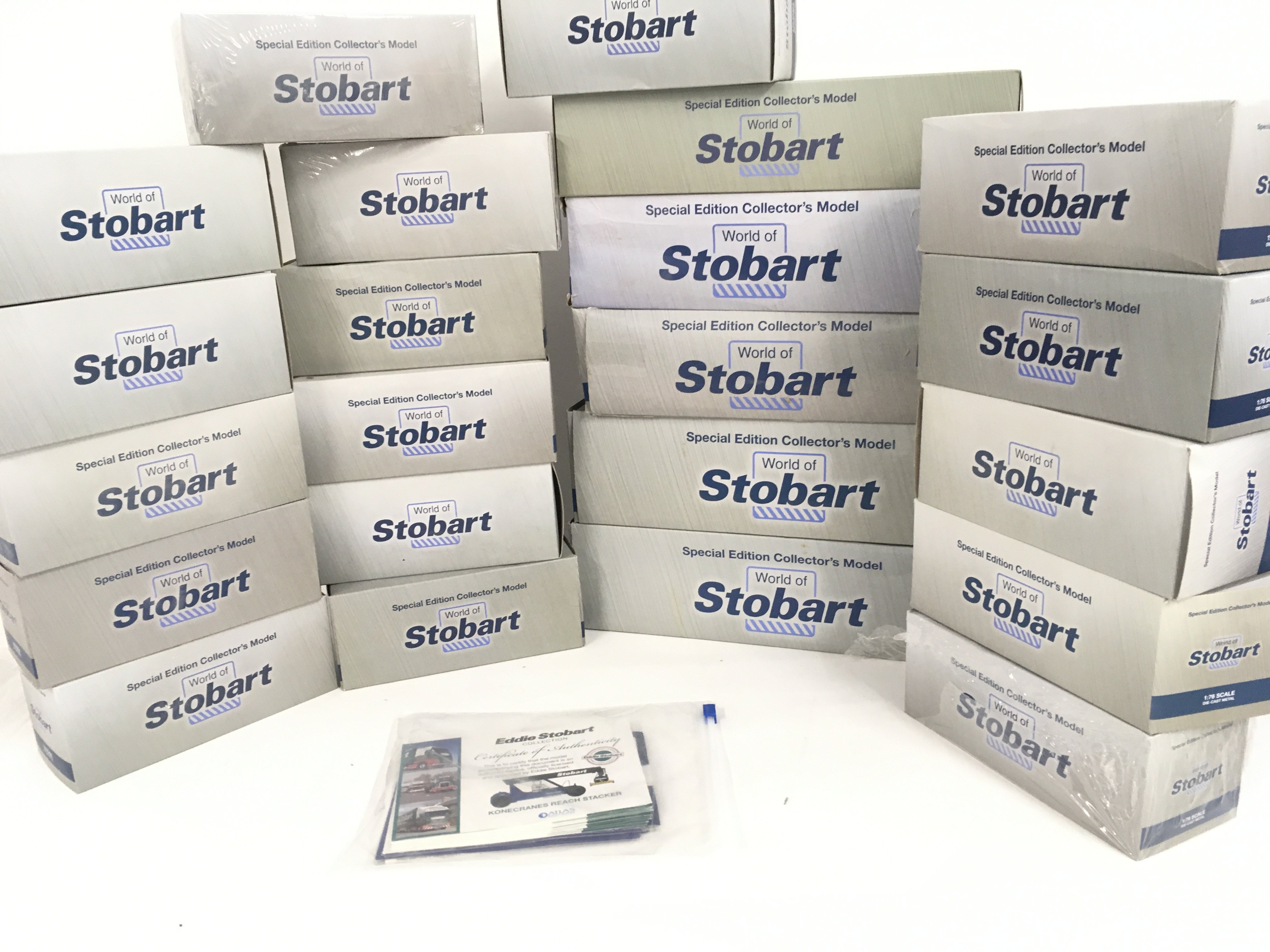A collection of 22 boxed commercial vehicles by Atlas in the World of Stobart series. Includes a pack with Certificates . No reserve.