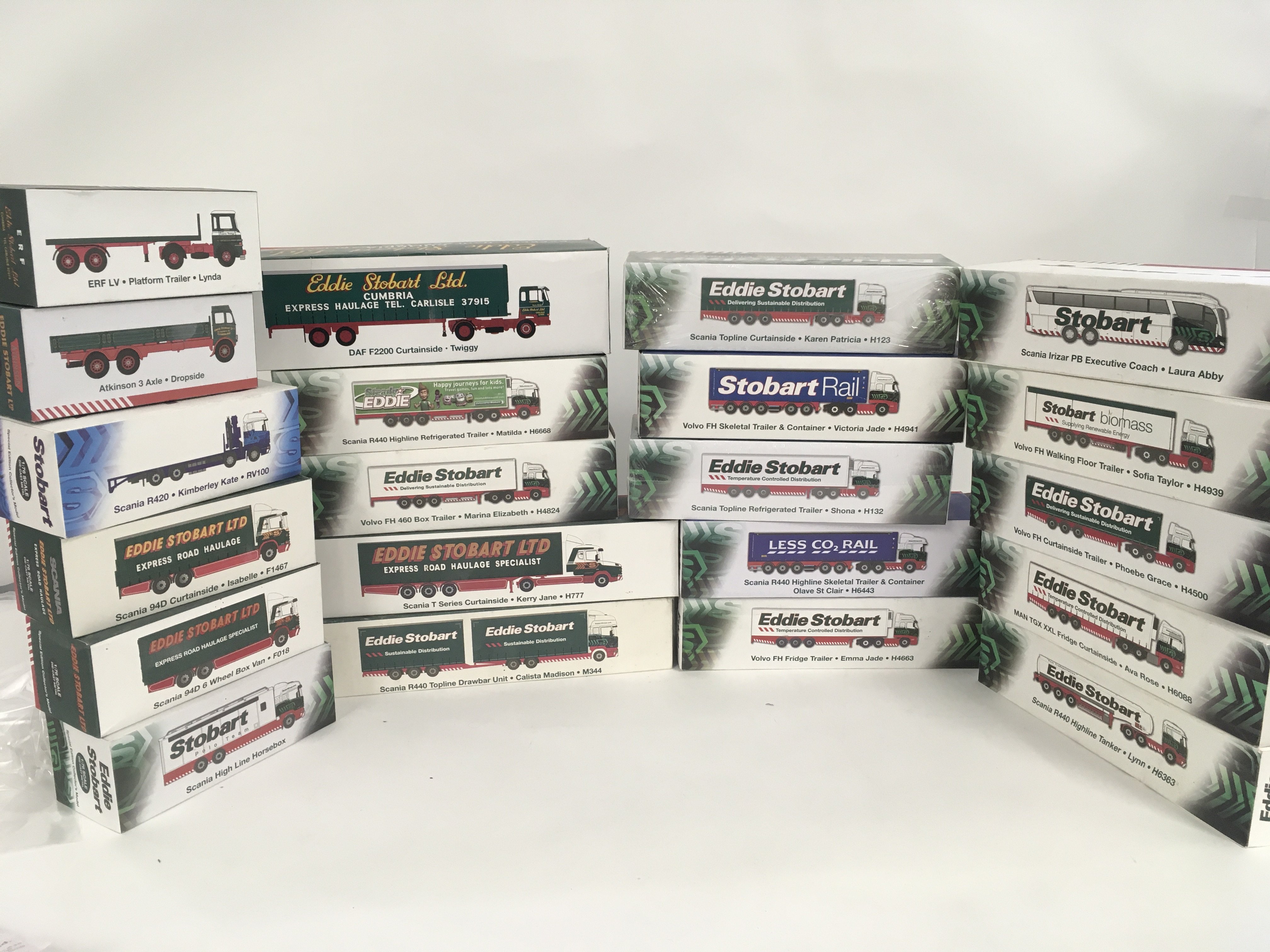 A Collection of 21 boxed Eddie Stobart themed commercial vehicles by Atlas and others. No Reserve