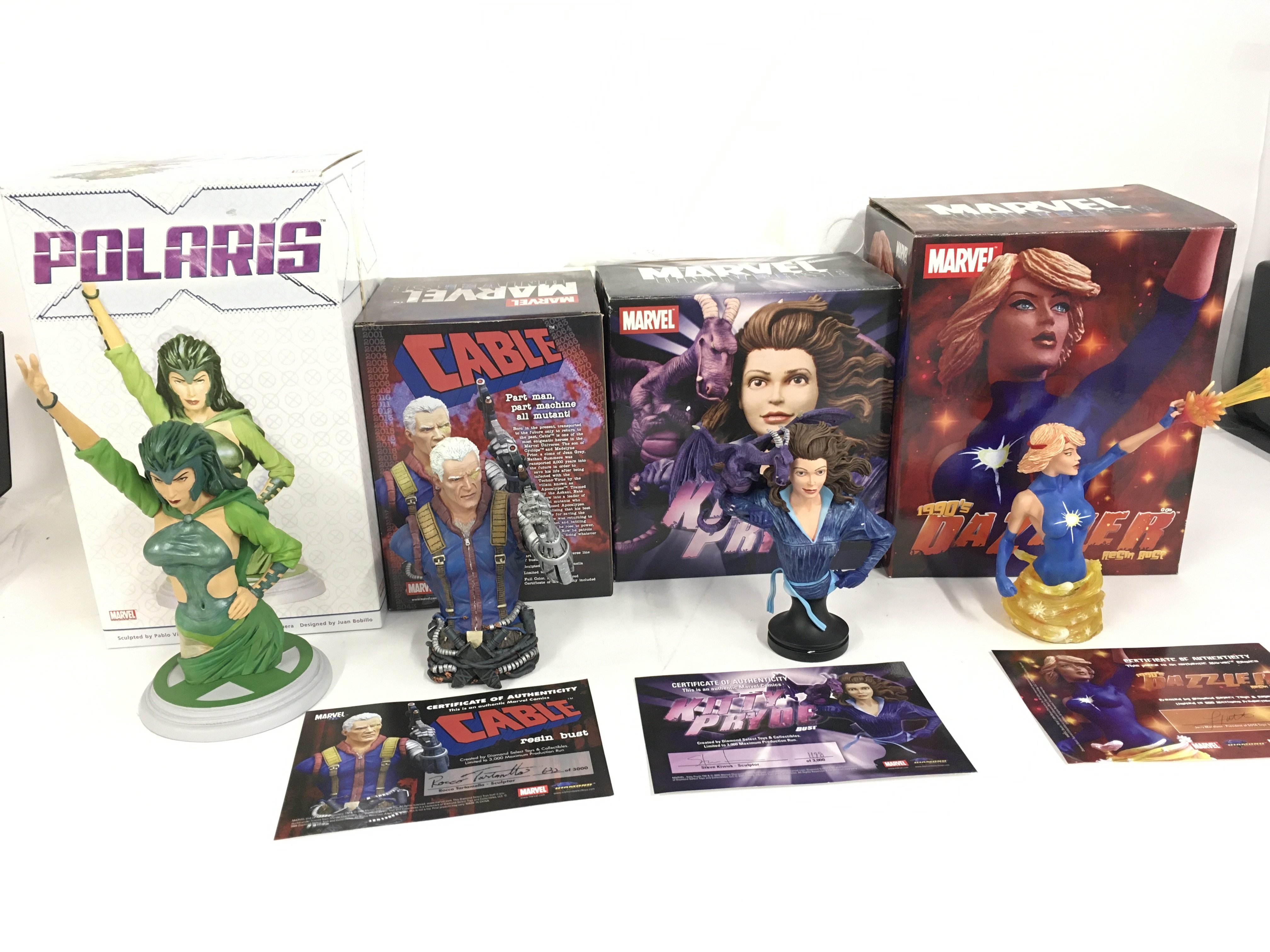 A collection of 4 Marvel sculptures featuring Polaris..Cable..Kitty Pryde and Dazzler. No reserve