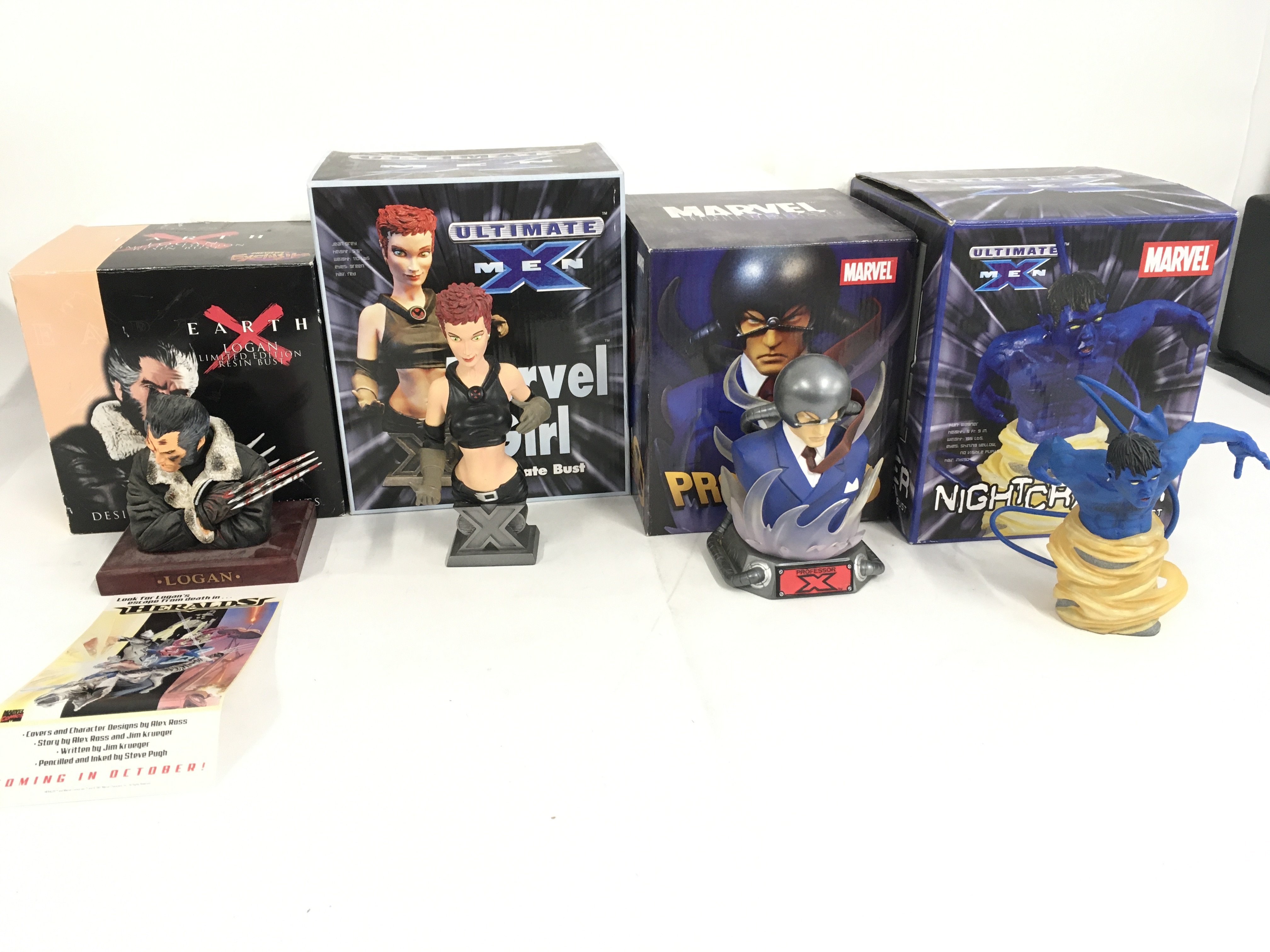 A collection of 4 boxed Marvel superhero sculptures including Logan..Marvel Girl..Professor X. and Nightcrawler. No reserve.