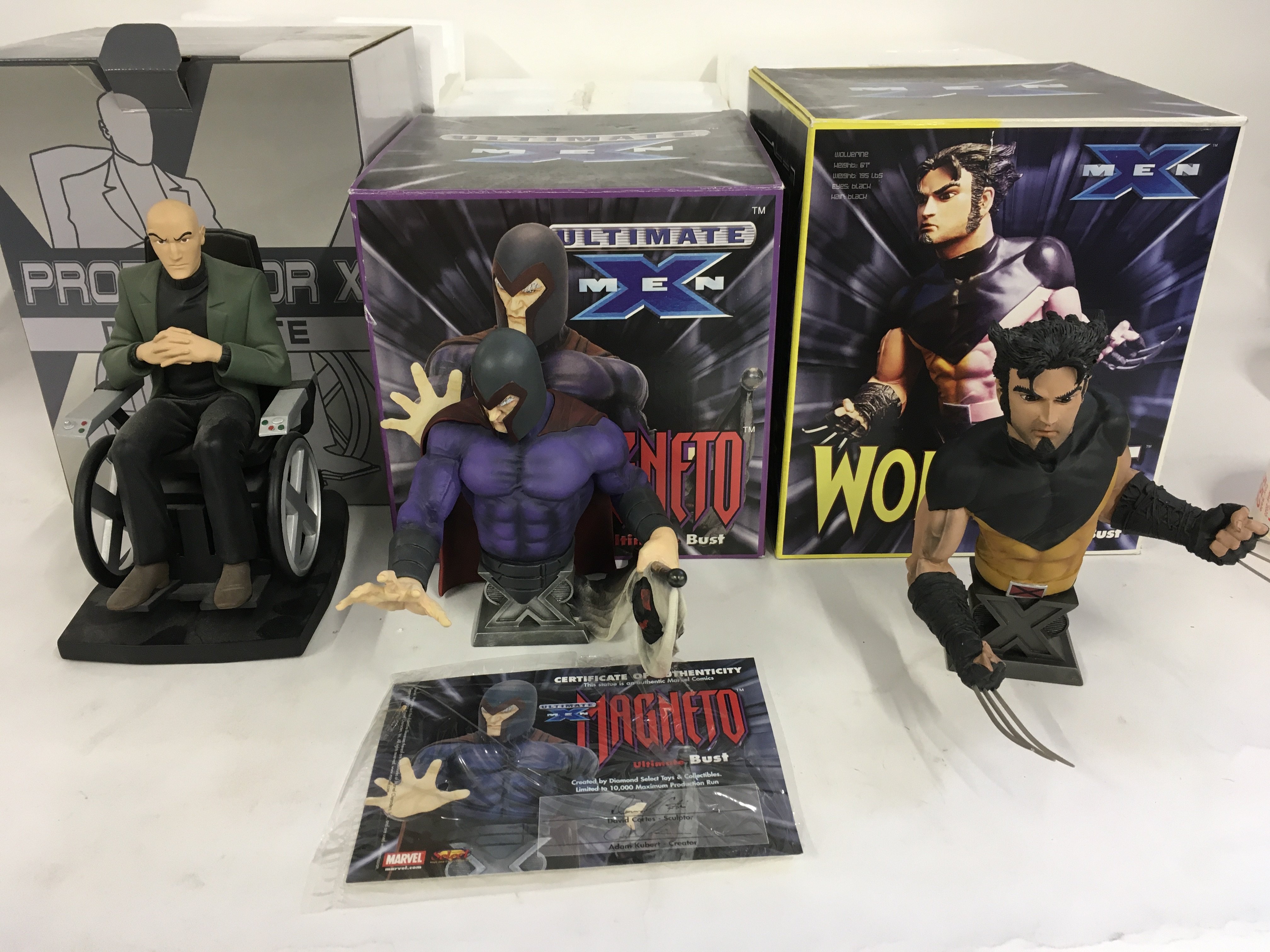 A collection of 3 boxed Marvel superhero sculptures featuring Professor X..Magneto..and Wolverine. No reserve.