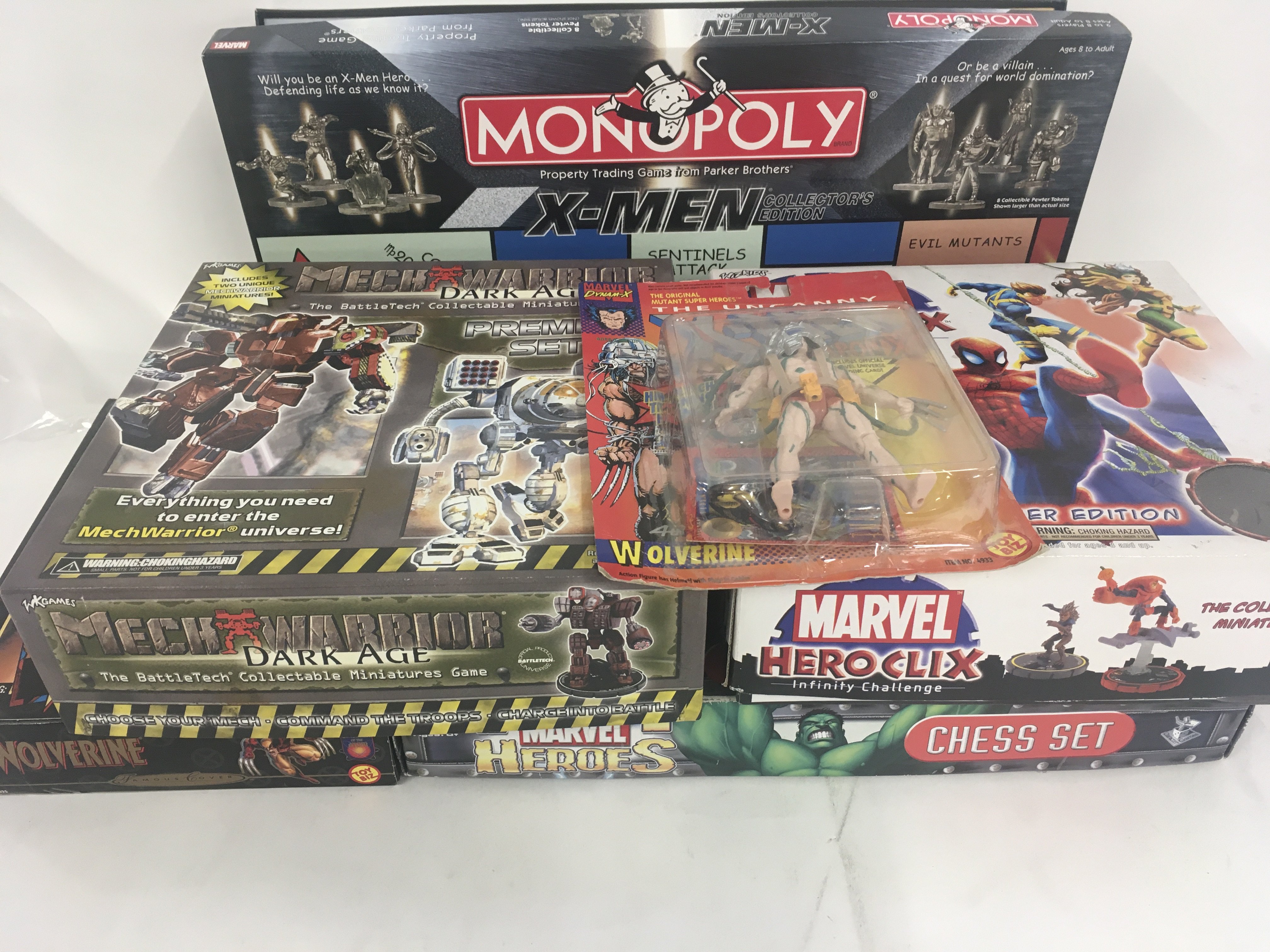 A collection ofSuperhero games and figures some unused others with additional playing pieces. No reserve
