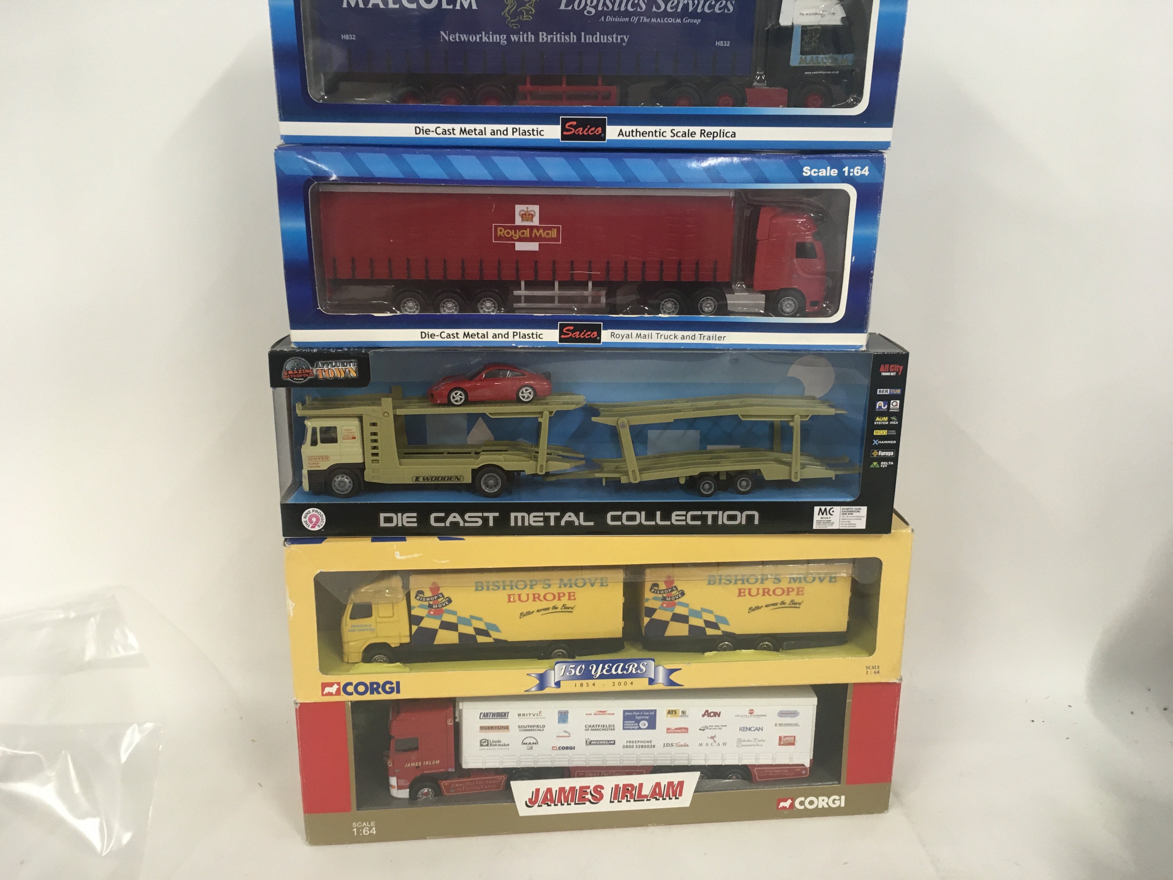 A collection of 5 boxed commercial diecast vehicles by Corgi..Saico etc. no reserve