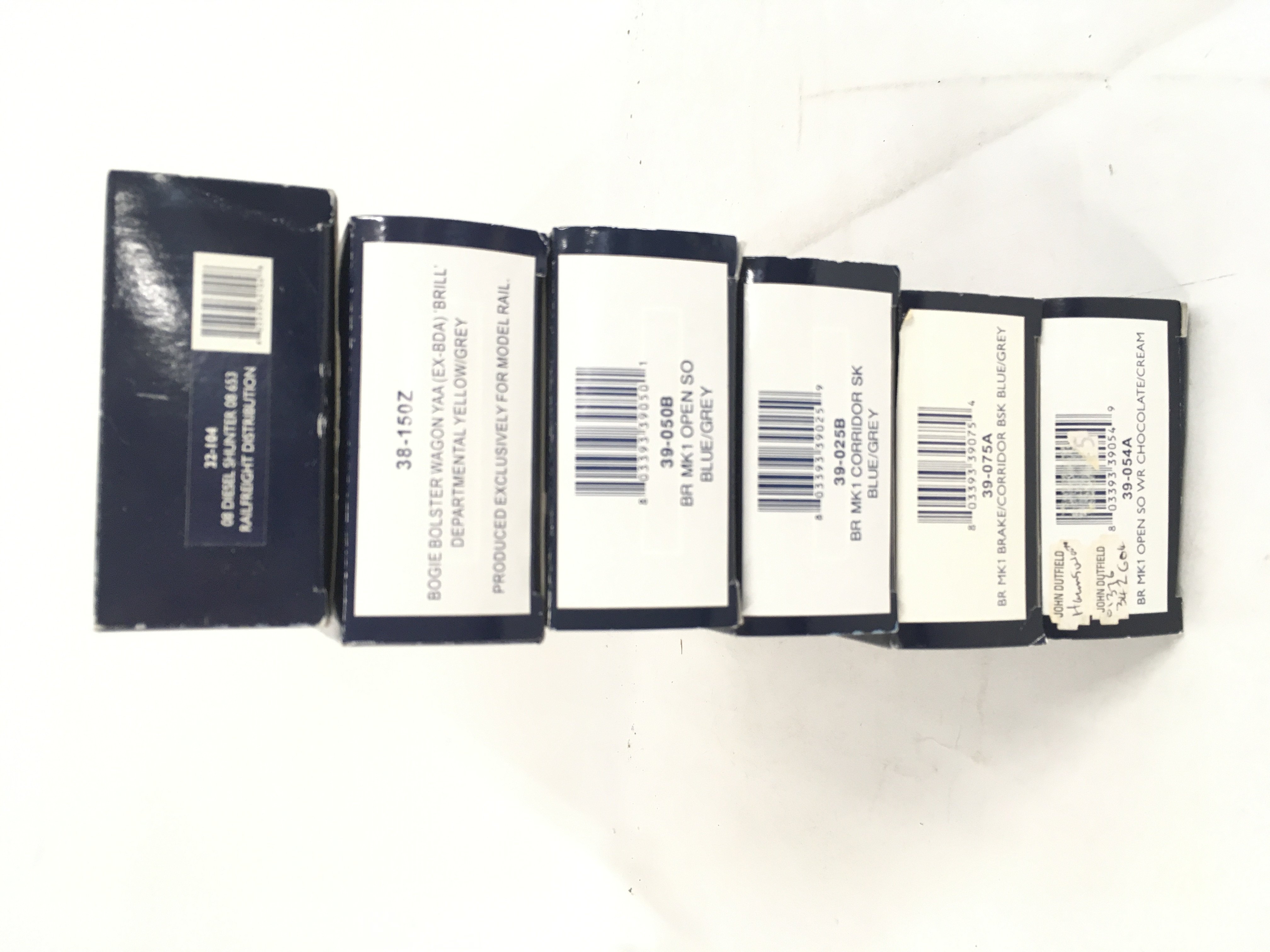 A collection of 6 boxed 00 gauge model railway pieces by Bachmann including Diesel shunter 32.104. 4 coaches 39.050B. 39.025B. 39.054A. 39.075A. and 38.150Z a bogie bolster wagon. No reserve