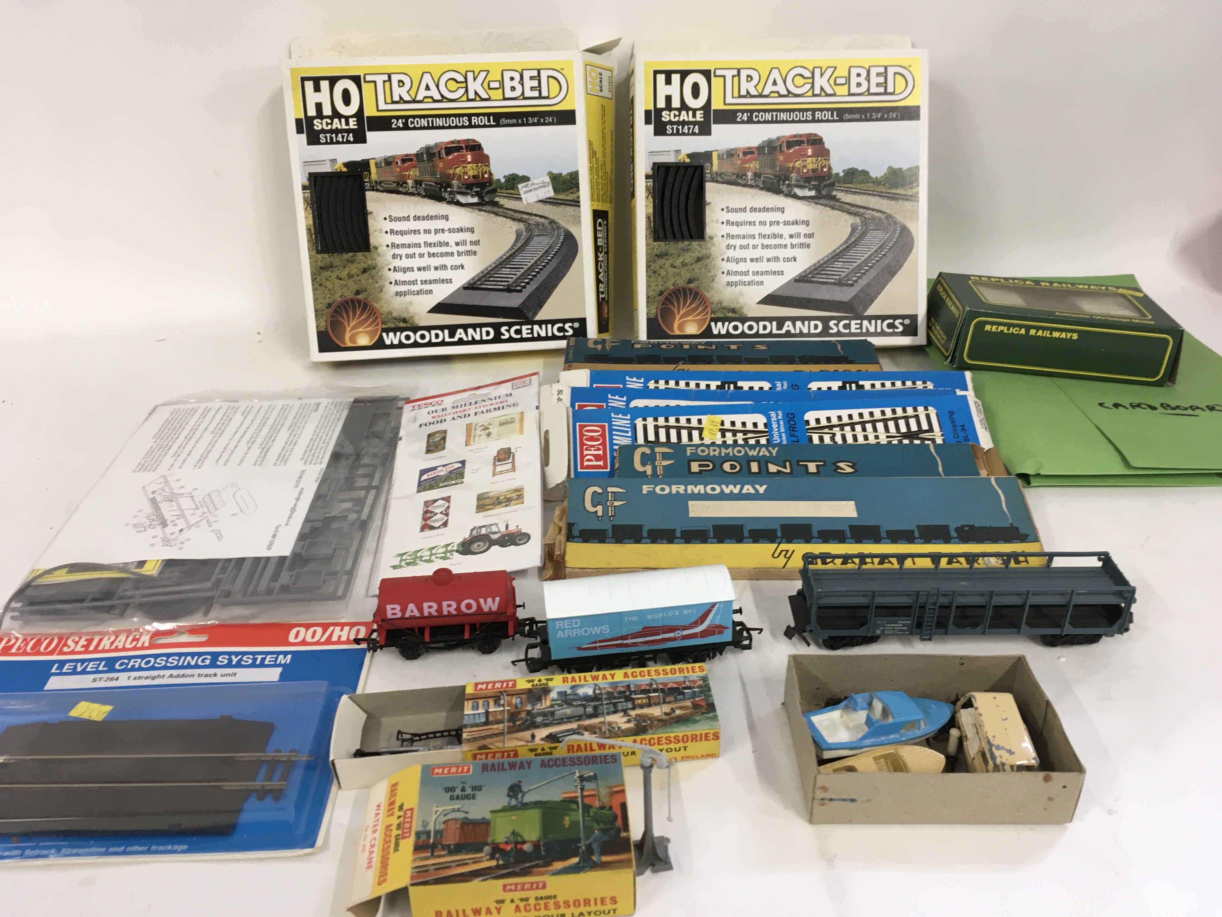 An assorted collection of OO gauge model railway pieces including wagons..points..scenery etc. no reserve