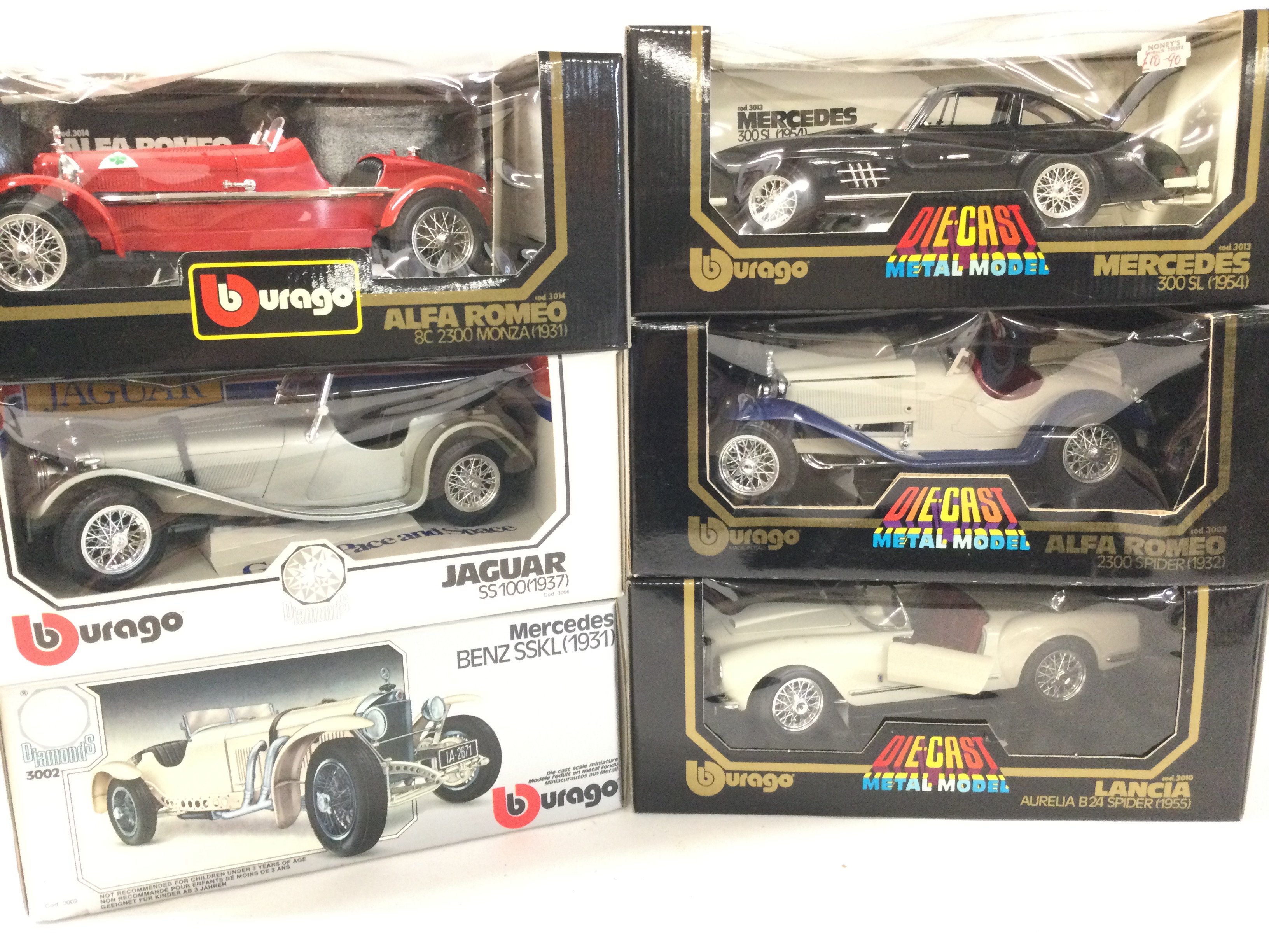 A Collection of 6 Boxed Burago Diecast Cars 1/18 Scale.