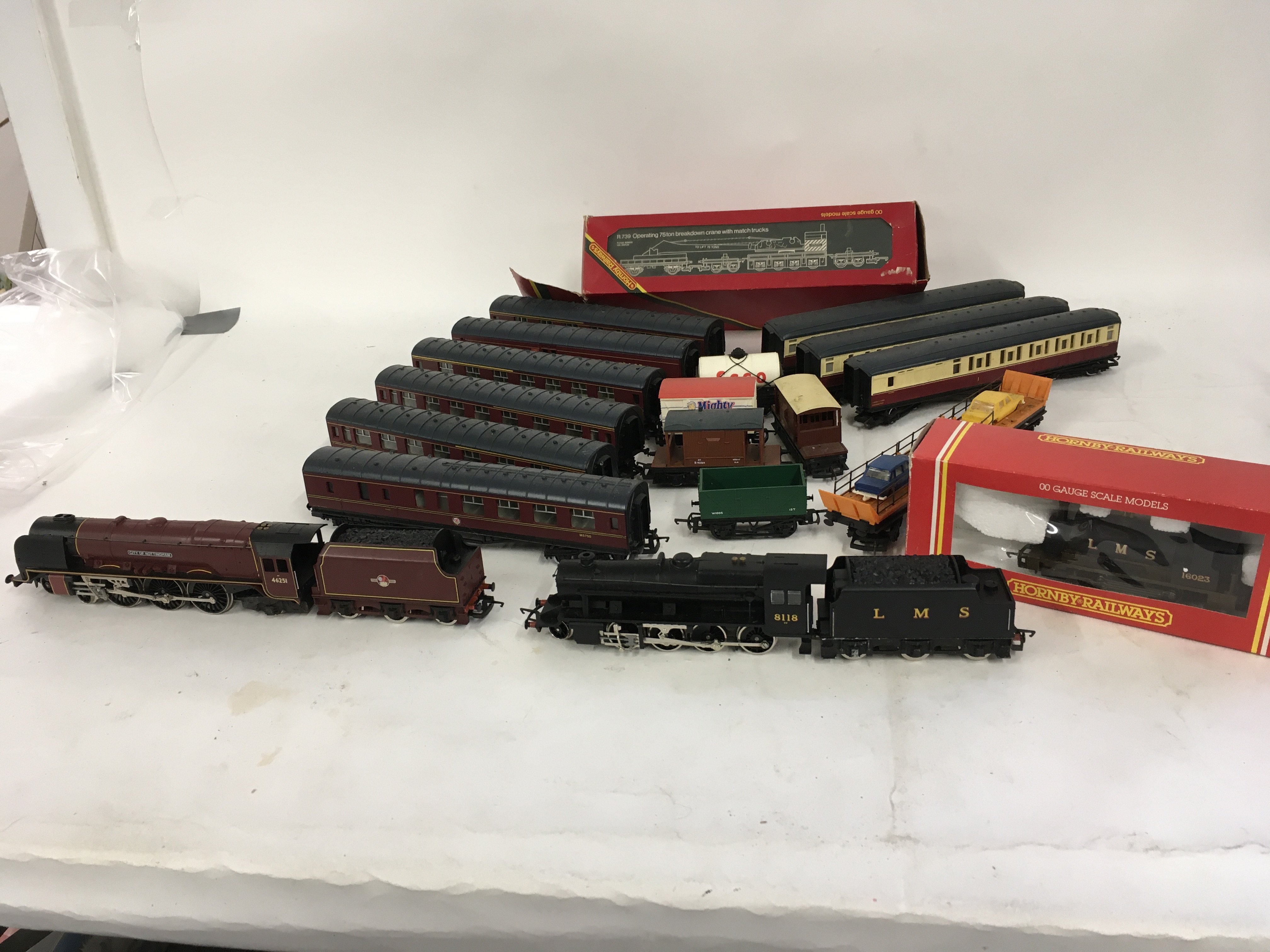 A collection of unboxed 00 gauge model railway Locomotives. Coaches and wagons mostly Hornby. No reserve.