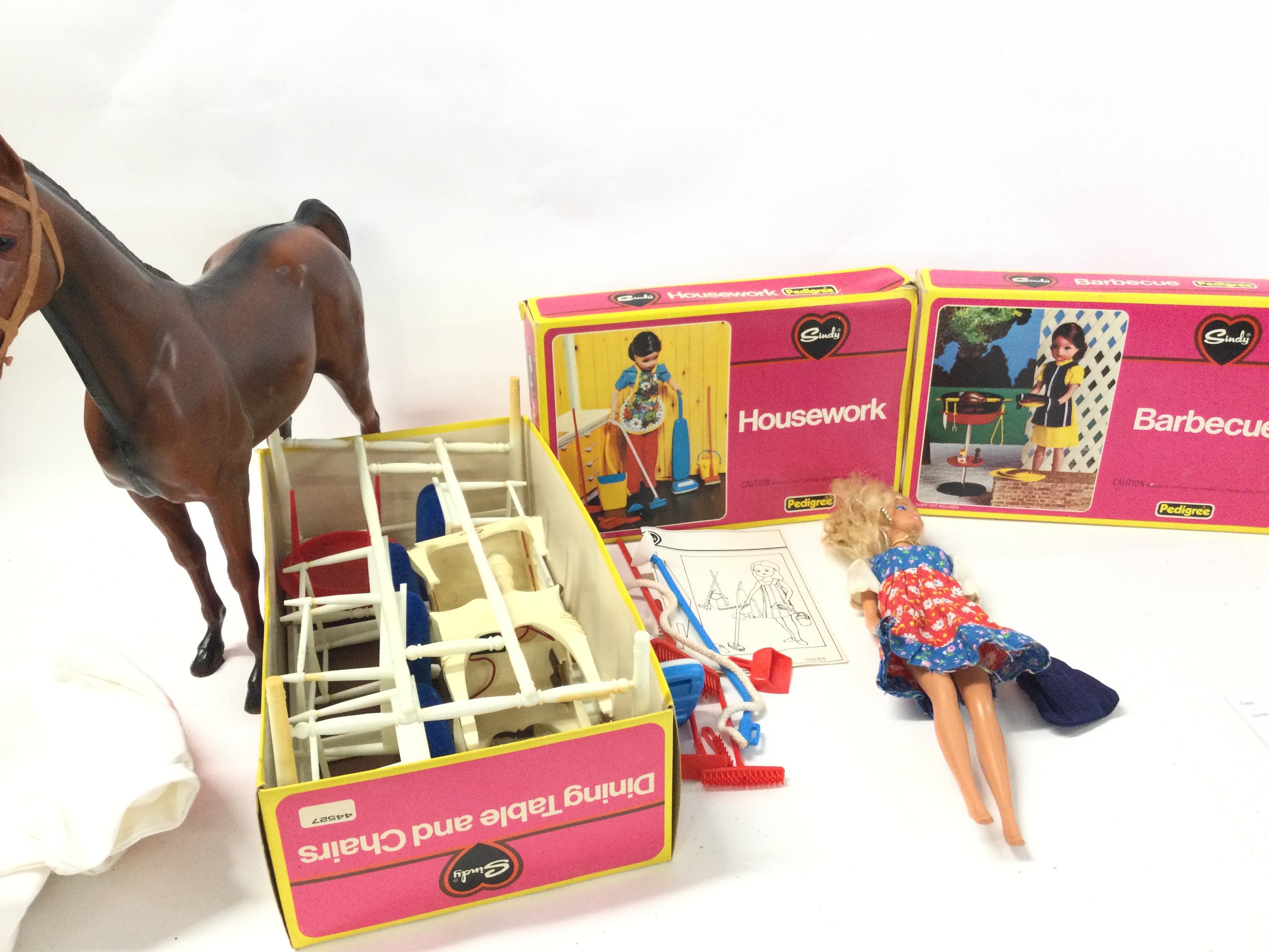 A Box Containing A Collection of Sindy Accessories and a Doll. No Reserve.