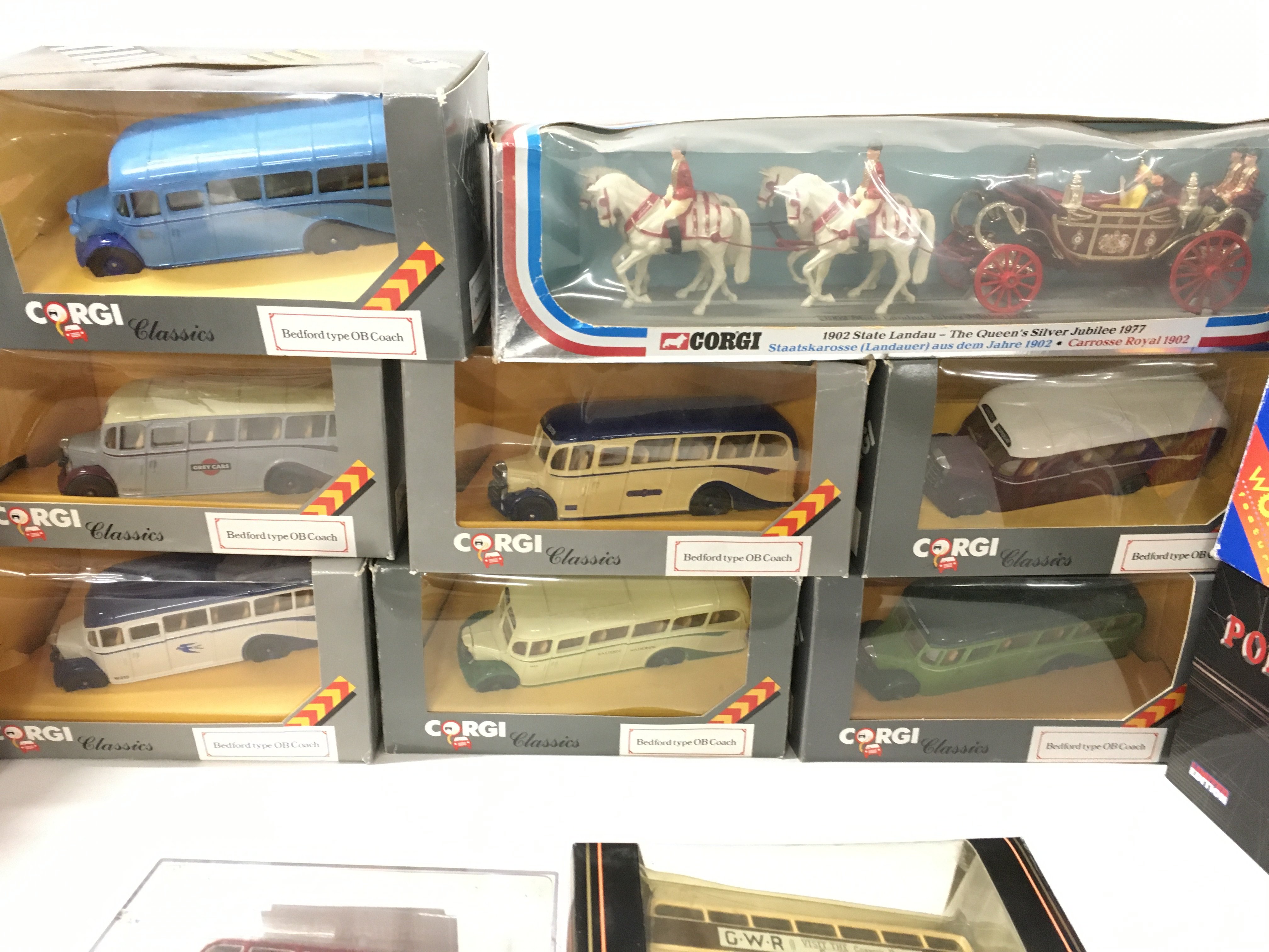 A collection in excess of 10 boxed model diecast vehicles mainly buses. Also includes plastic model of queens jubilee coach with horses. Mostly by Corgi..EFE. No reserve