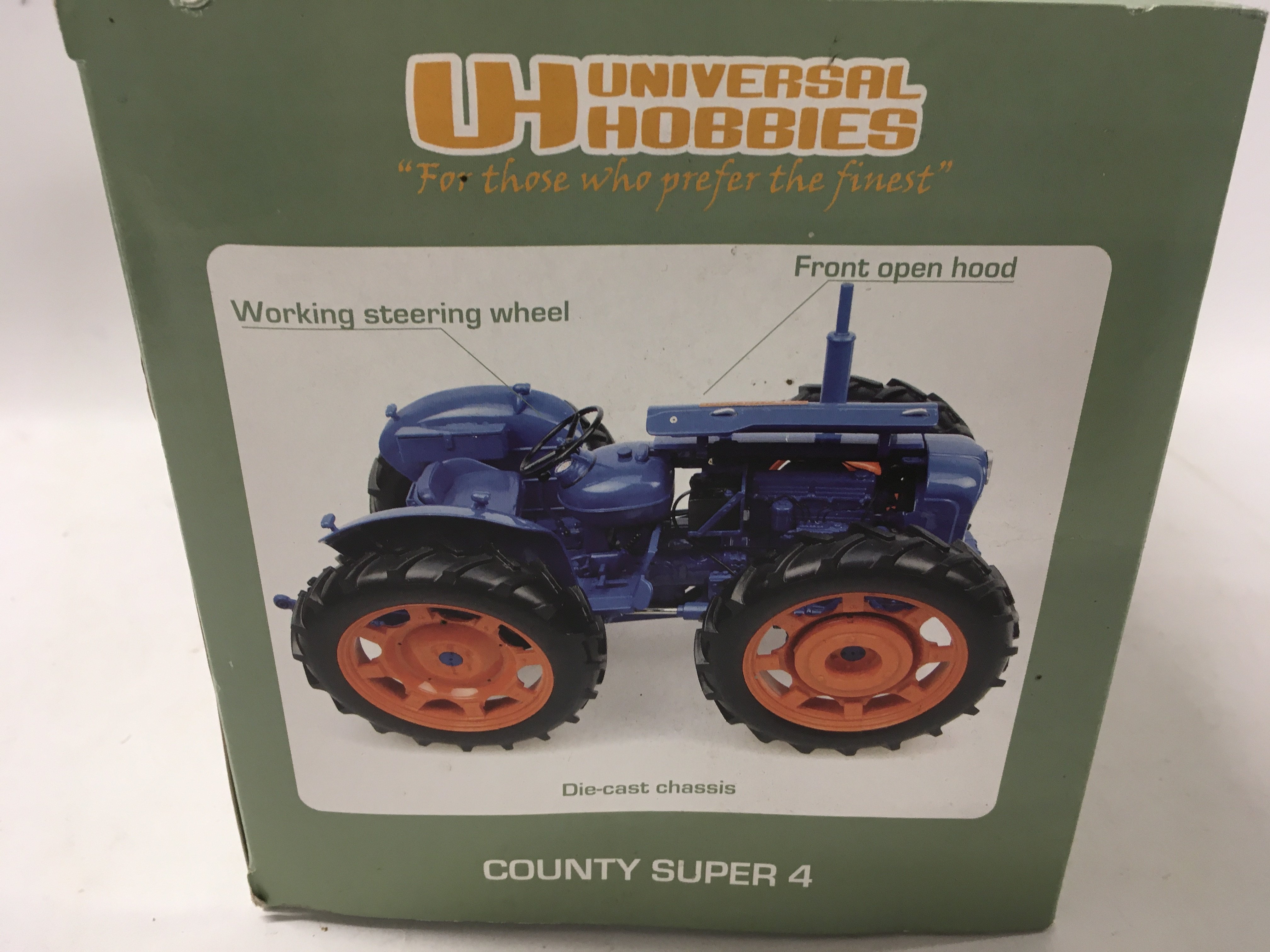Boxed County Super 4 model tractor by Universal Hobbies 1:16 scale. No reserve