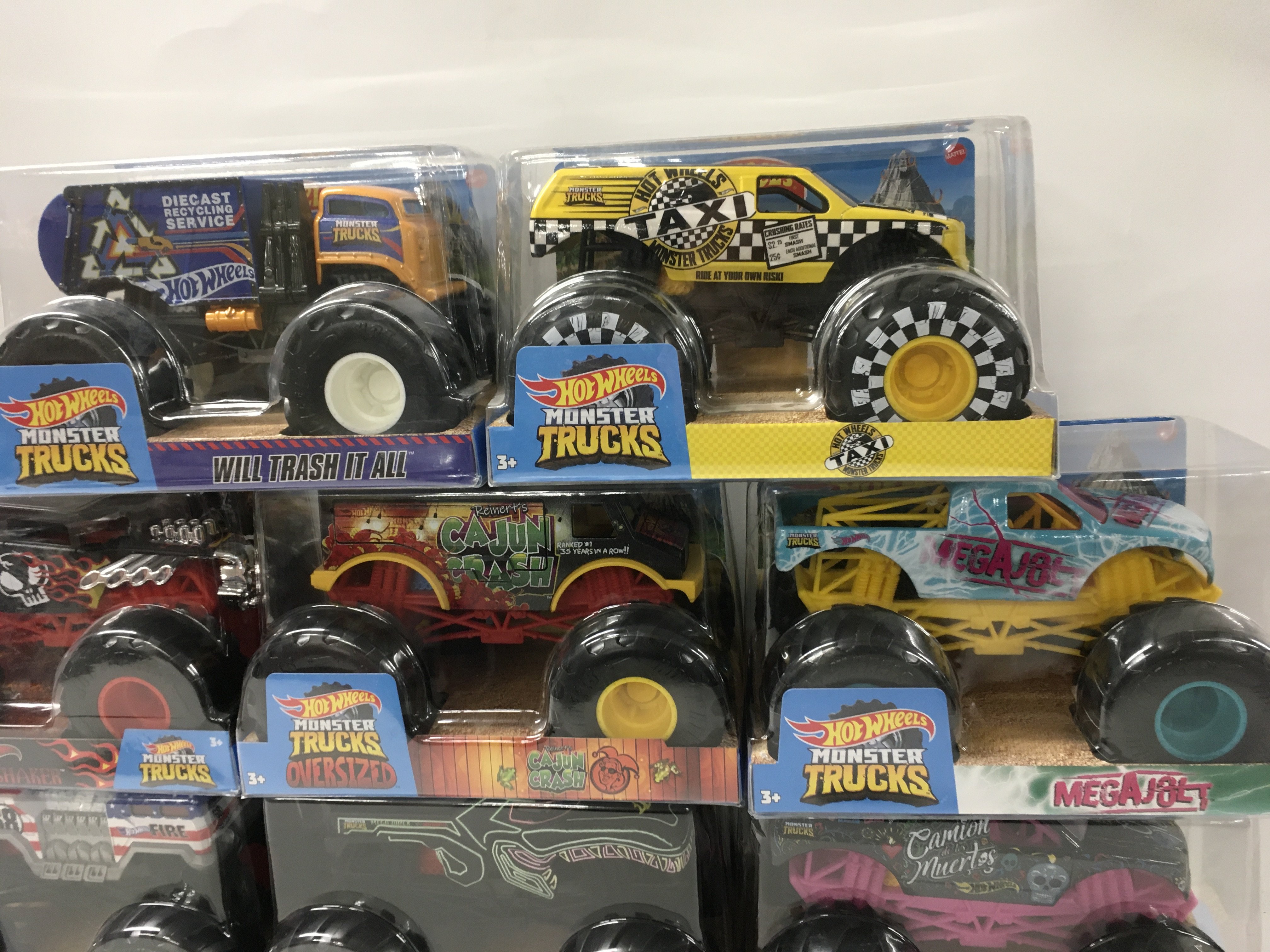 A collection of 8 unopened Hot Wheels Monster Trucks 1:24 scale. Includes Cajun Crash..Bone Shaker plus others. No Reserve